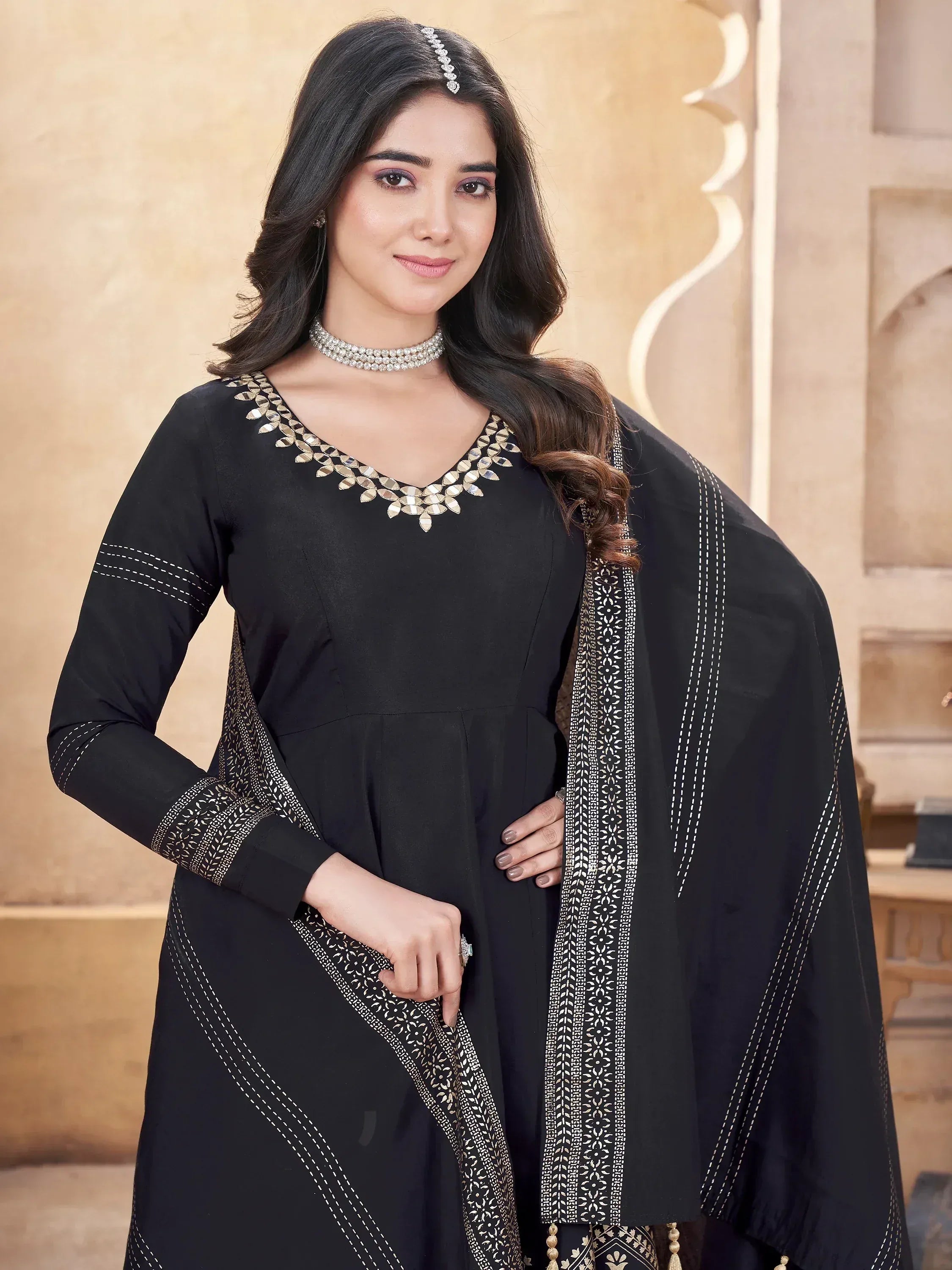 Black ethnic salwar kameez with gold mirror work and white embroidery, perfect for Indian festive wear