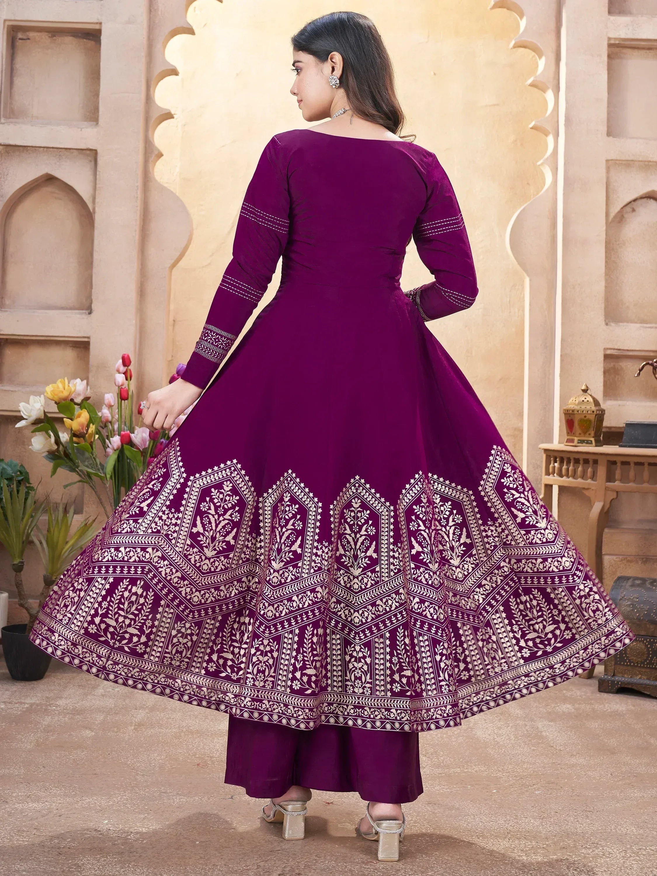 Purple ethnic anarkali gown with white floral print, long sleeves, and flared skirt for Indian occasions