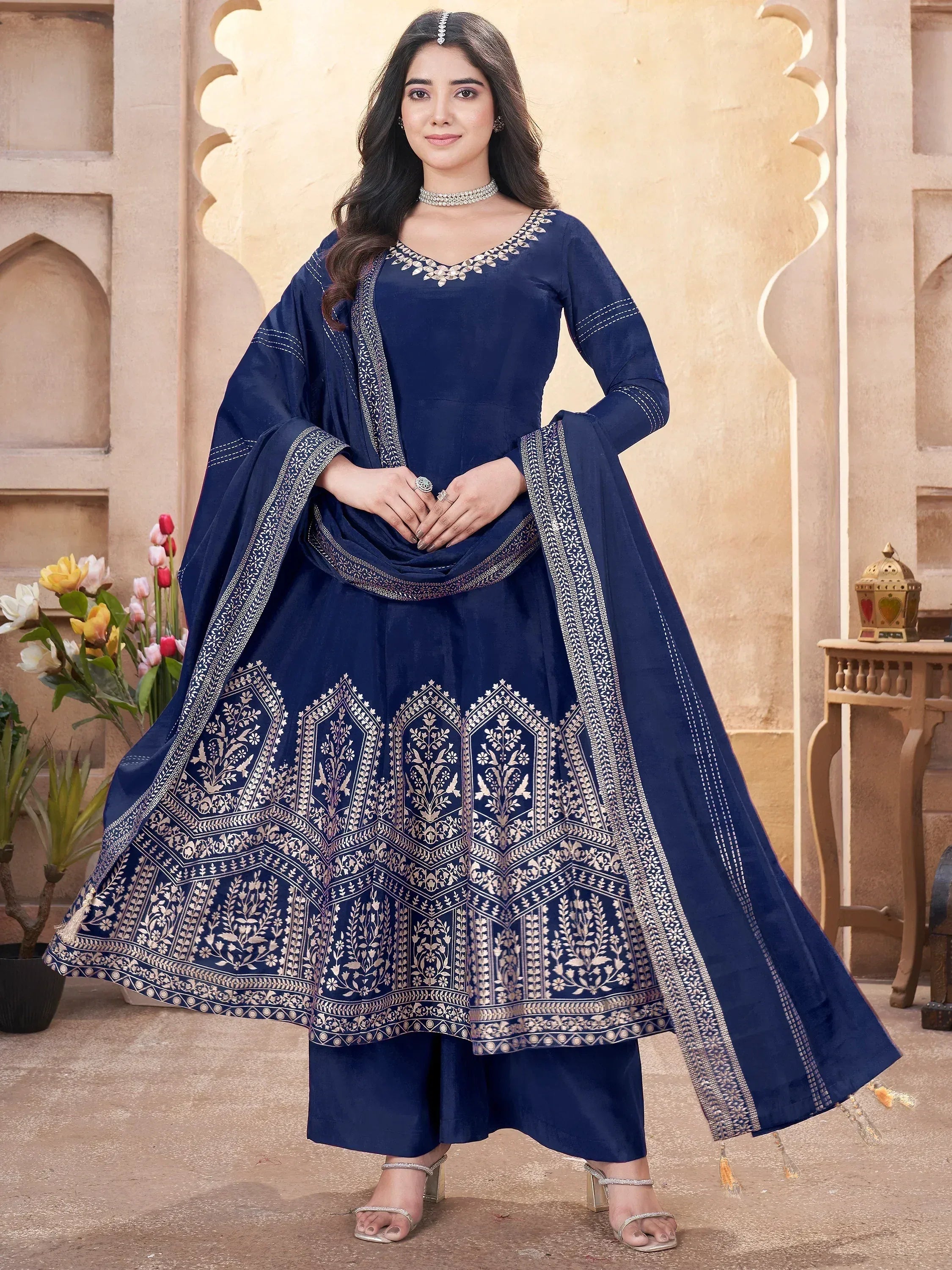 Navy blue ethnic anarkali suit with gold embroidery, perfect for Indian weddings and festive occasions.