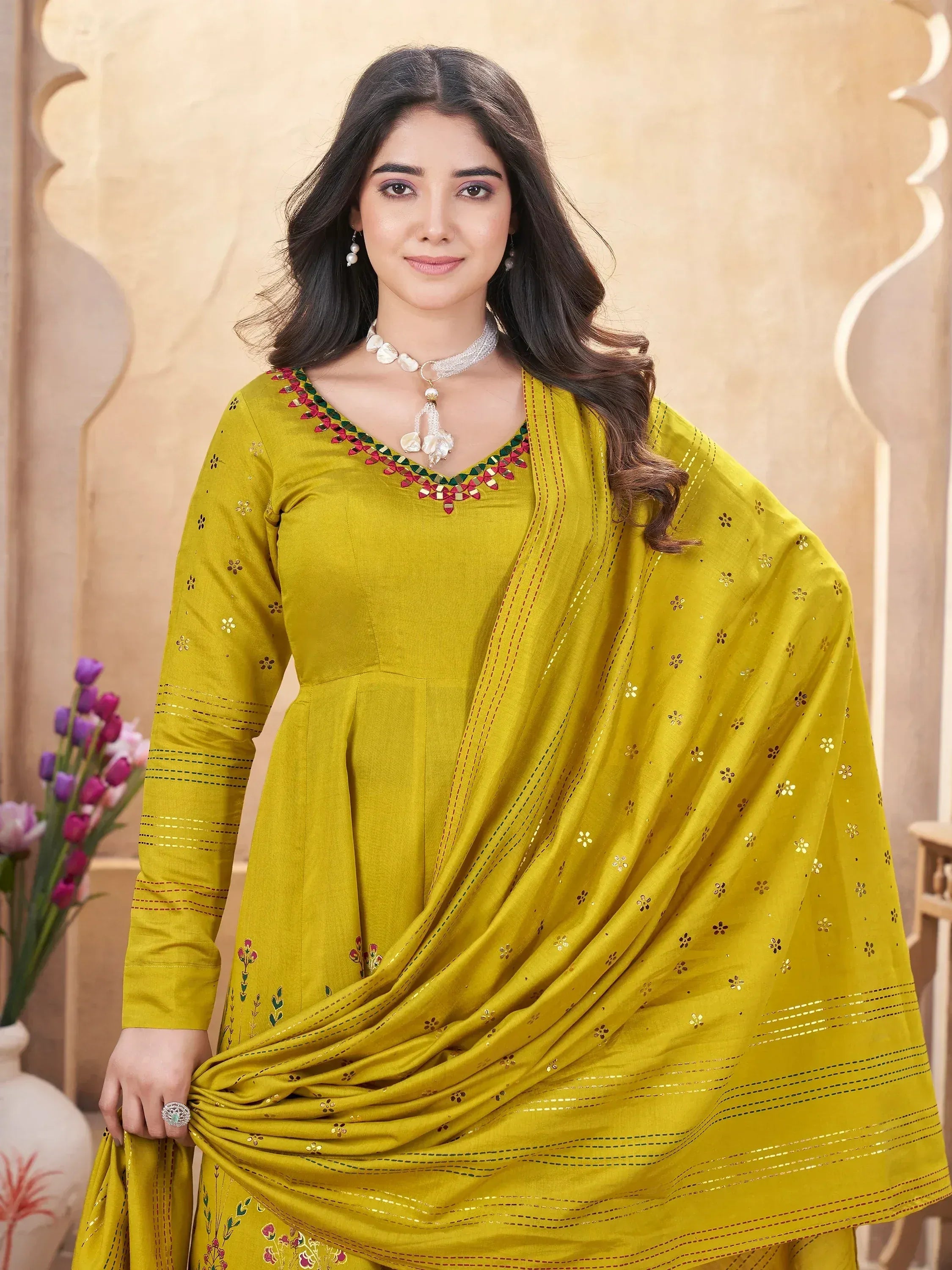Yellow embroidered salwar kameez with floral detailing and matching dupatta, ideal for ethnic occasions