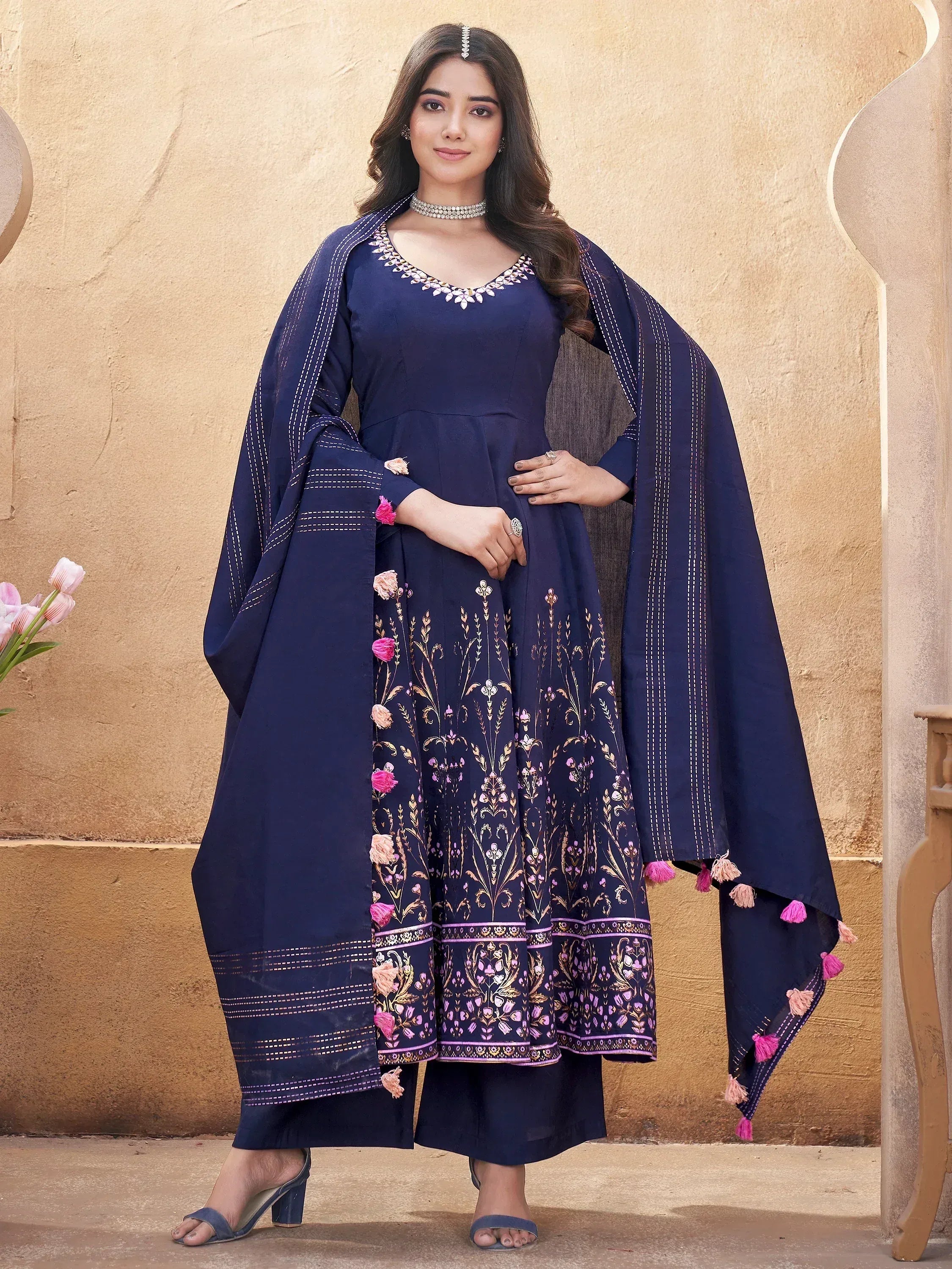 Navy blue embroidered anarkali suit with floral motifs and tassel dupatta, perfect for Indian ethnic occasions