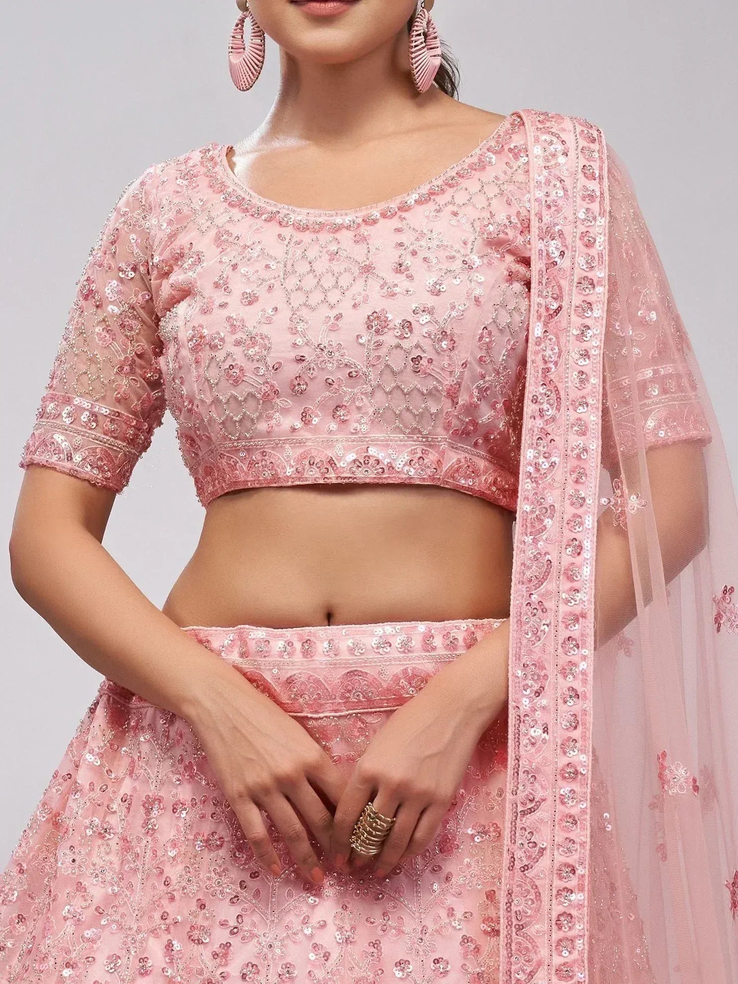 Pink embroidered lehenga choli with floral sequin detailing and matching dupatta