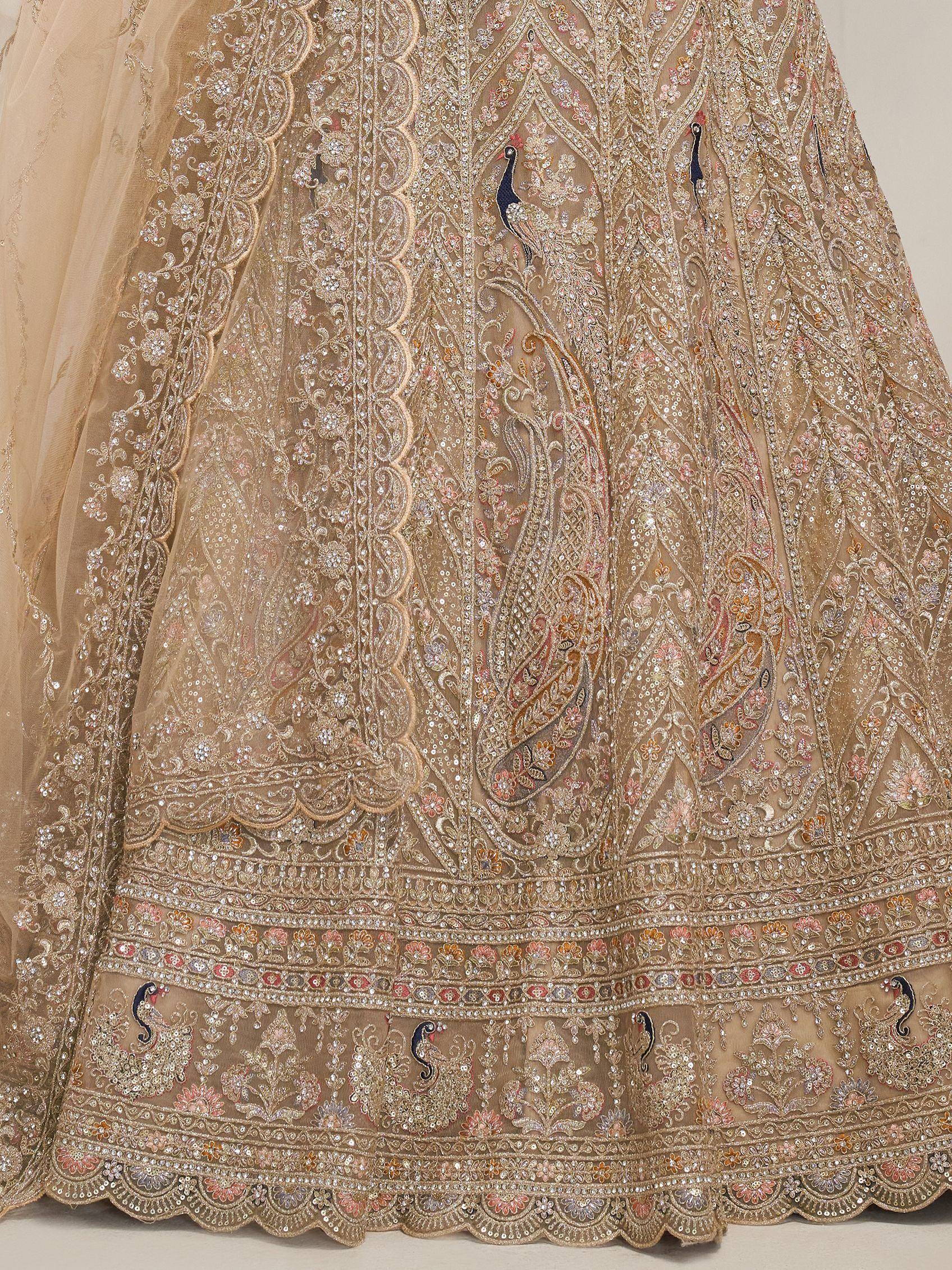 Beige embroidered lehenga with peacock motifs, floral patterns, and sequin detailing for Indian ethnic wear