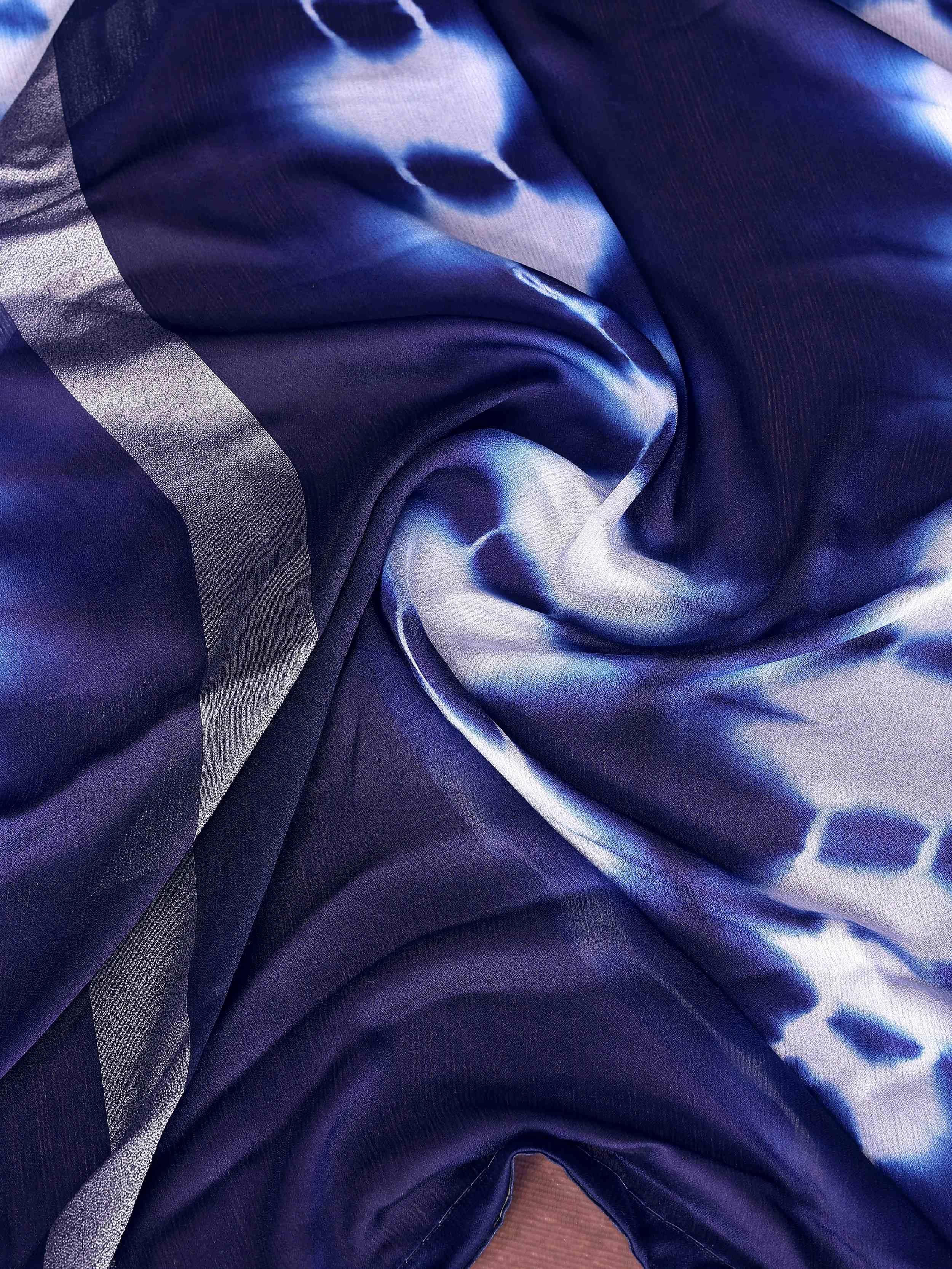 Blue tie-dye ethnic fabric with silver border, ideal for designer lehenga or saree
