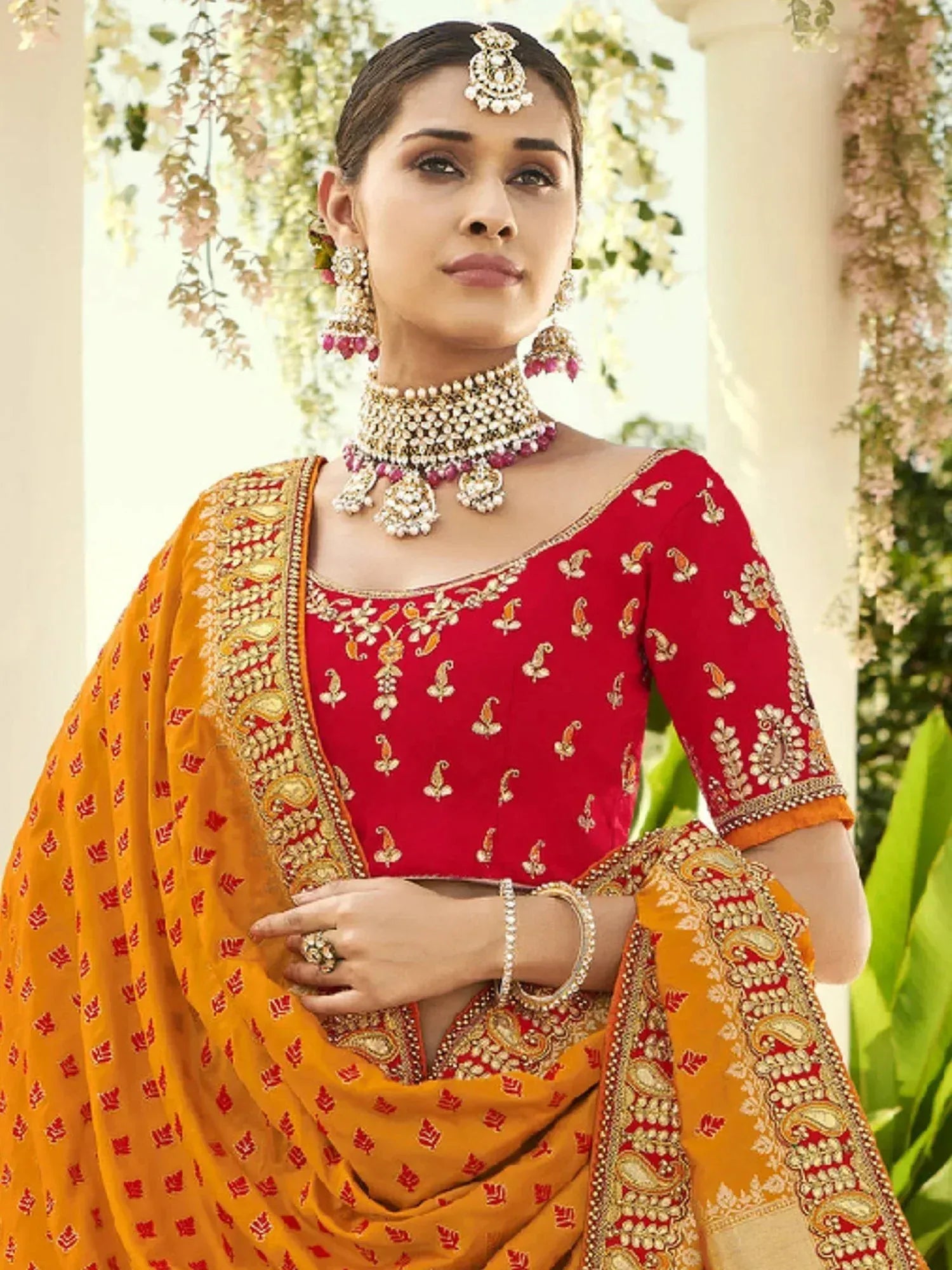 Red and gold embroidered lehenga choli with matching dupatta, traditional Indian ethnic wear for weddings
