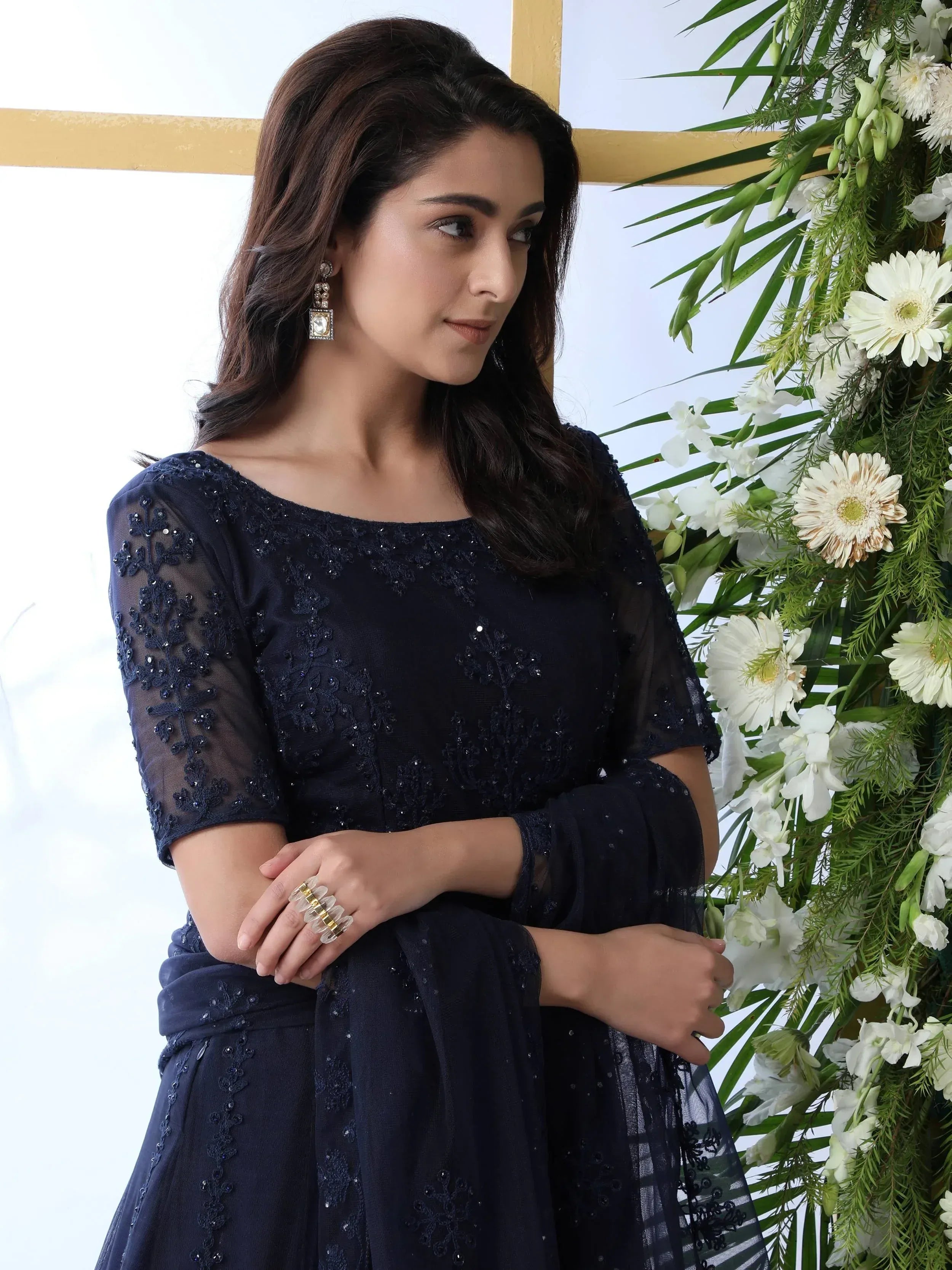 Navy blue embroidered ethnic gown with sheer sleeves, perfect for Indian occasions and parties.