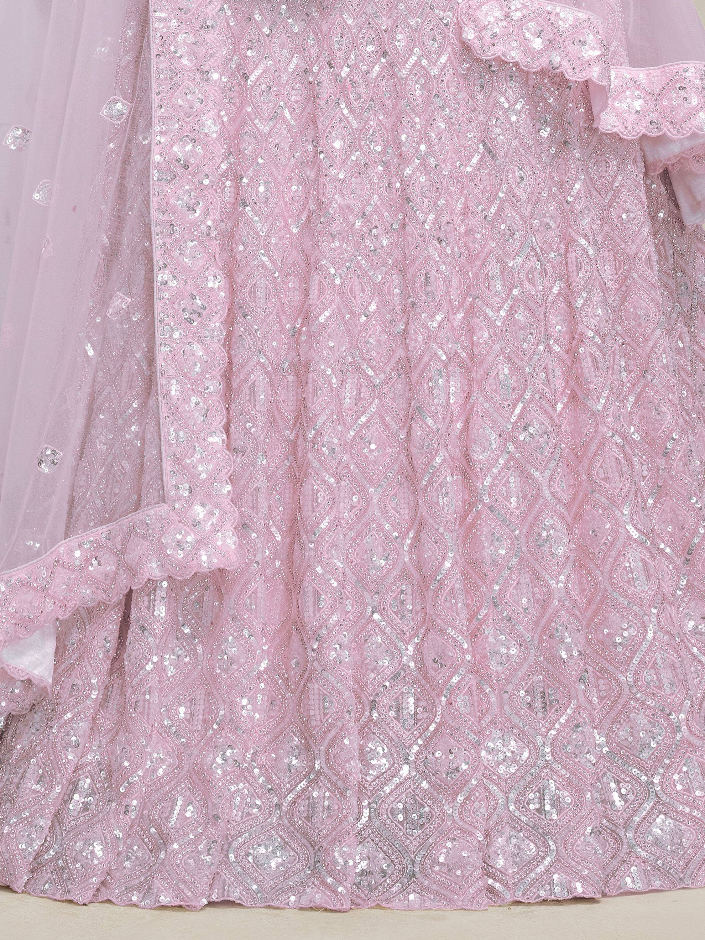 Pink sequin-embellished ethnic gown with ruffled sleeves and sheer overlay, perfect for festive occasions.