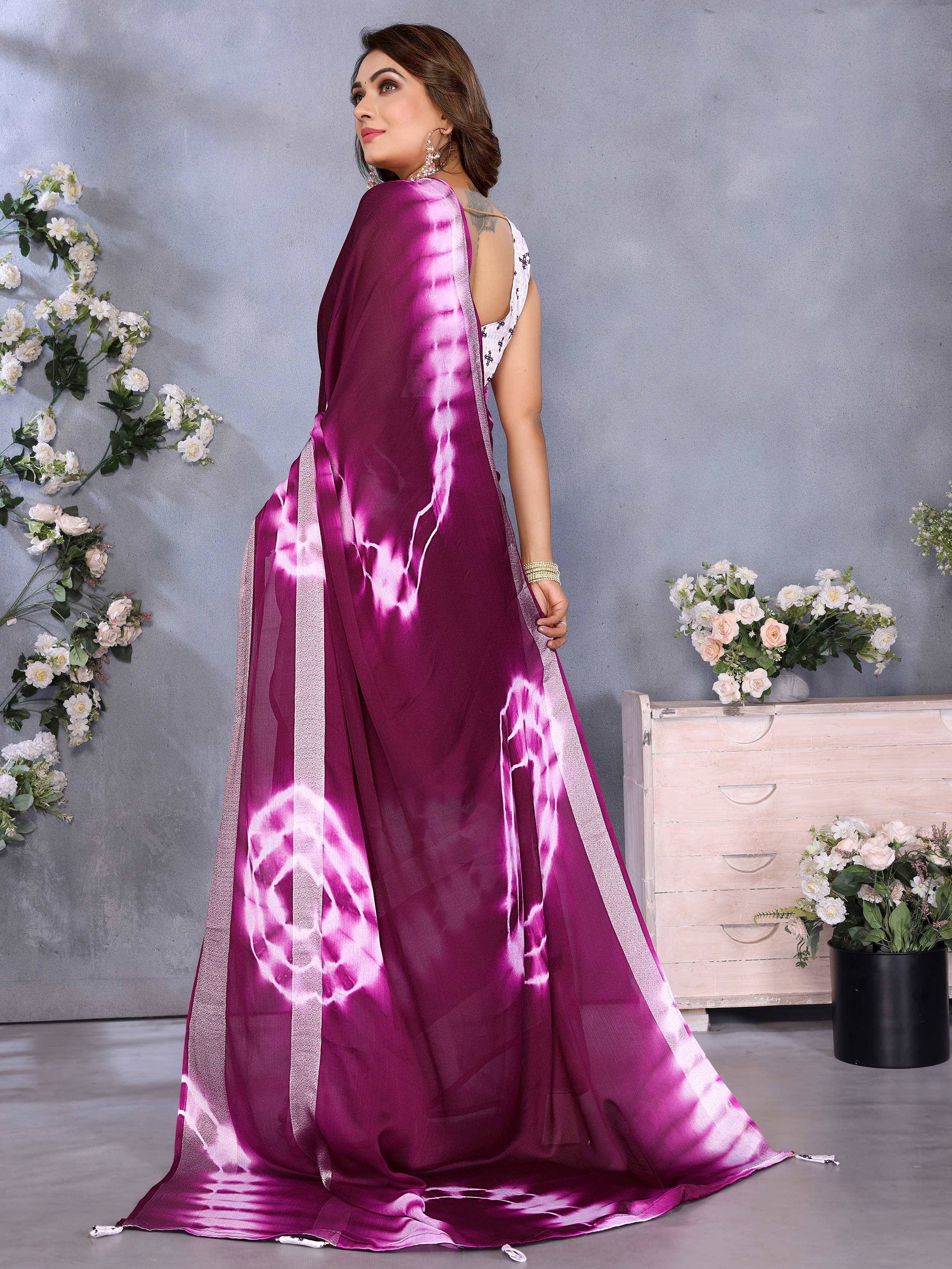 Purple tie-dye saree with silver border, styled with white blouse for ethnic wear