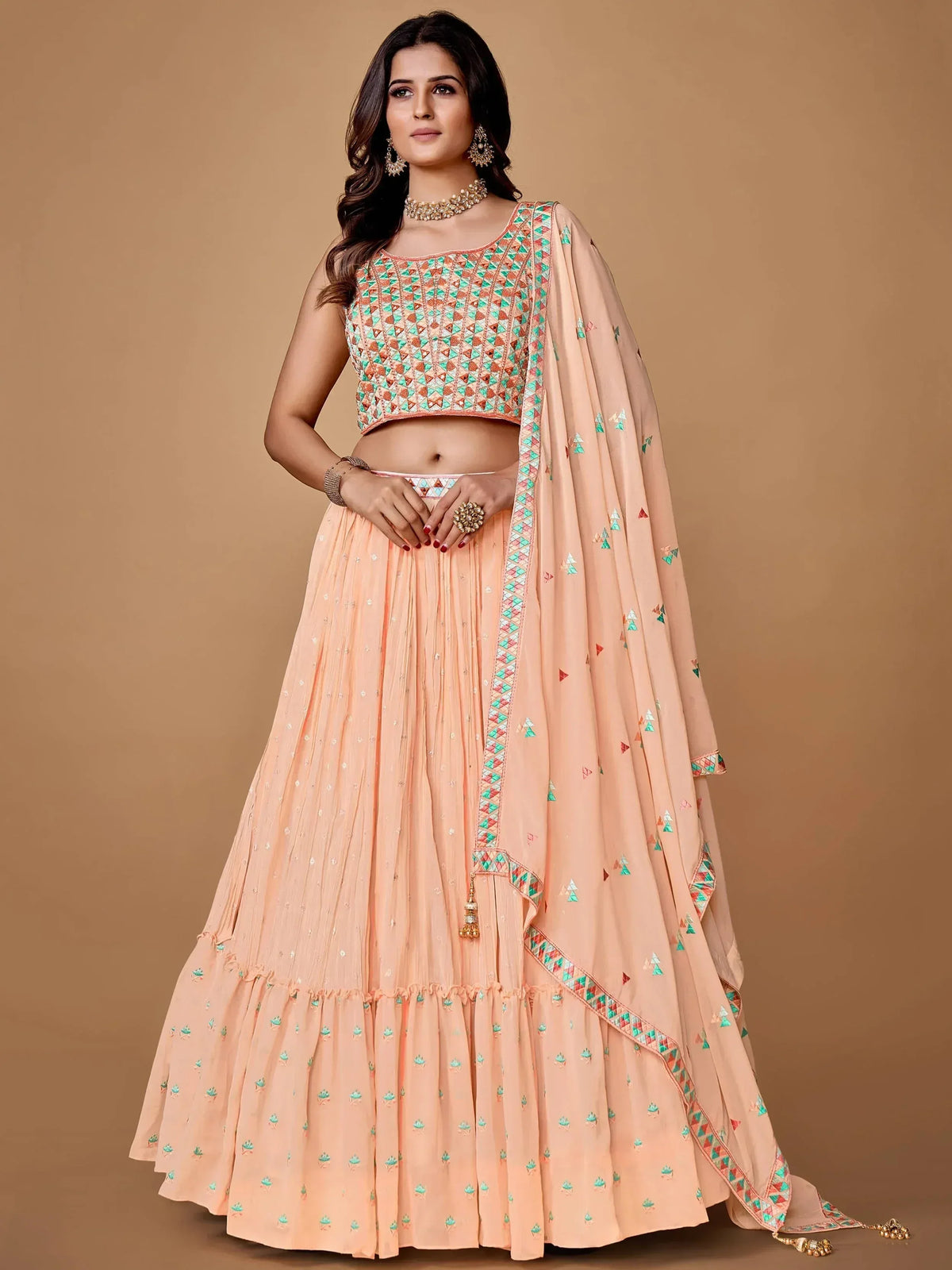 Peach lehenga choli with geometric embroidery, perfect for Indian ethnic wear and festive occasions