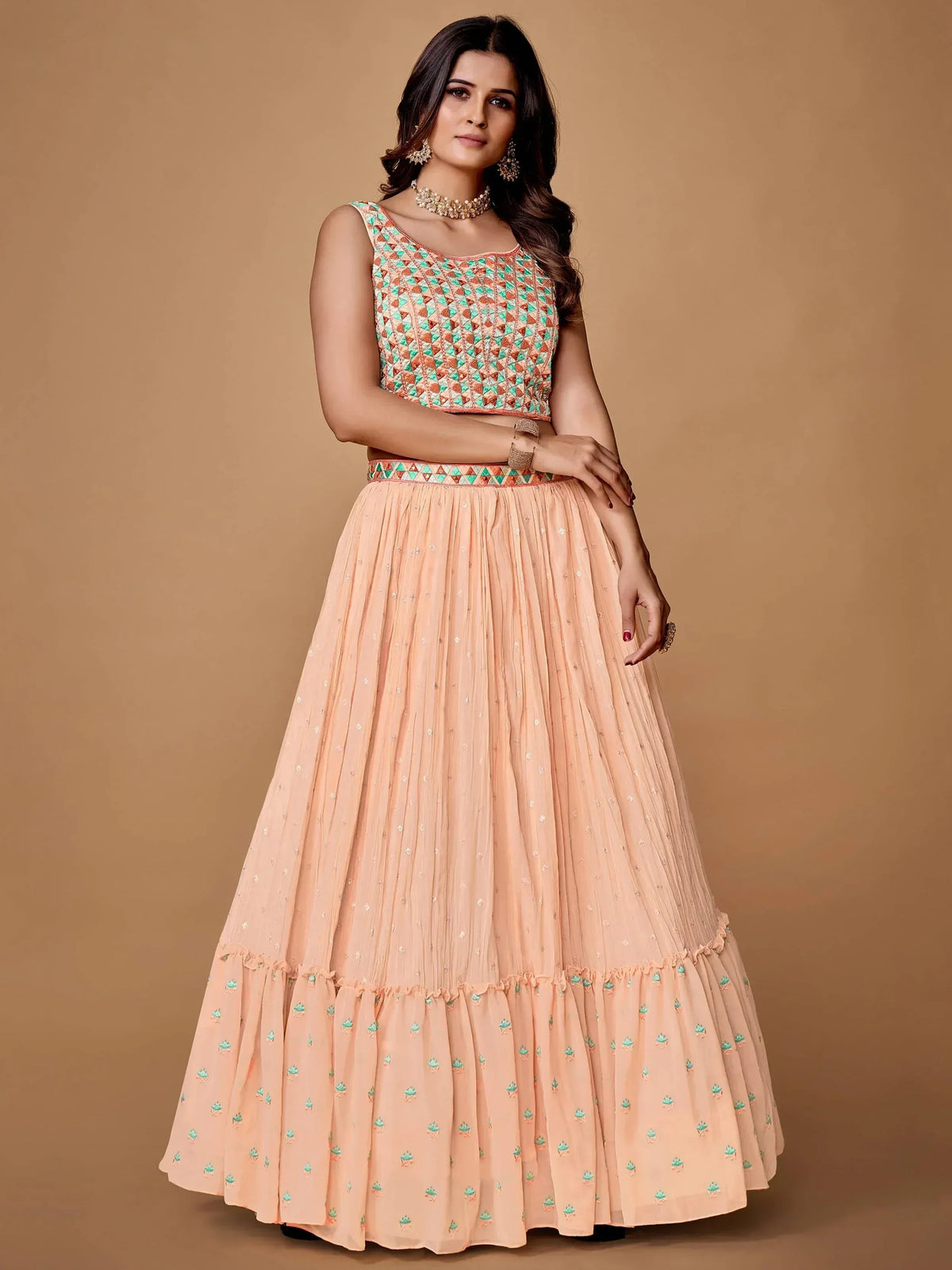 Peach lehenga choli with geometric embroidery and flared skirt for ethnic wear