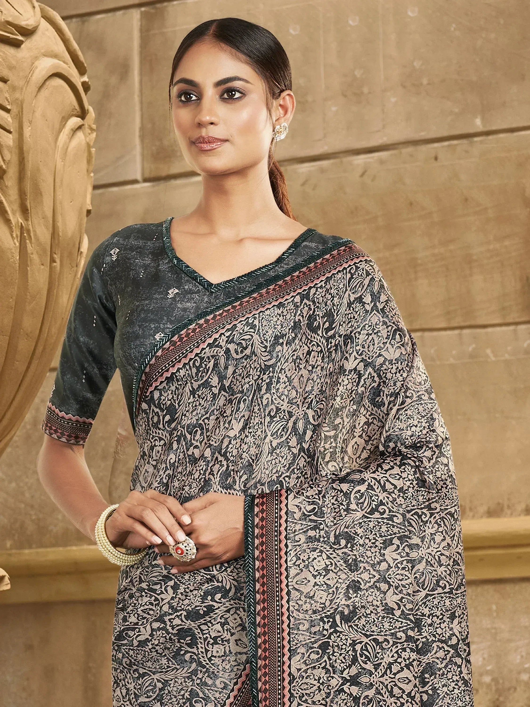 Elegant Indian ethnic saree with intricate floral print and contrast border, perfect for traditional occasions.