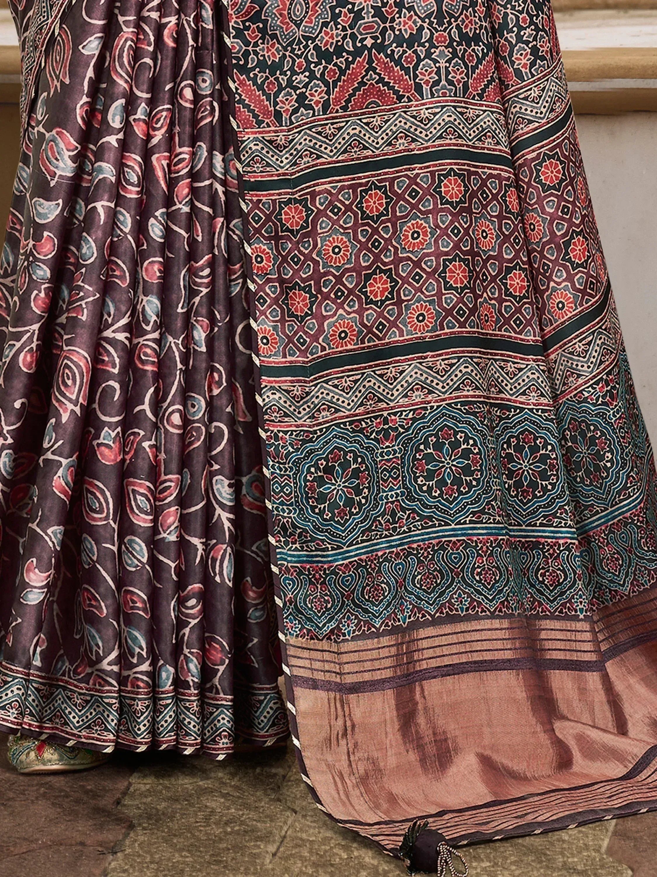 Ethnic printed lehenga choli with intricate floral and geometric patterns in maroon, teal, and gold tones