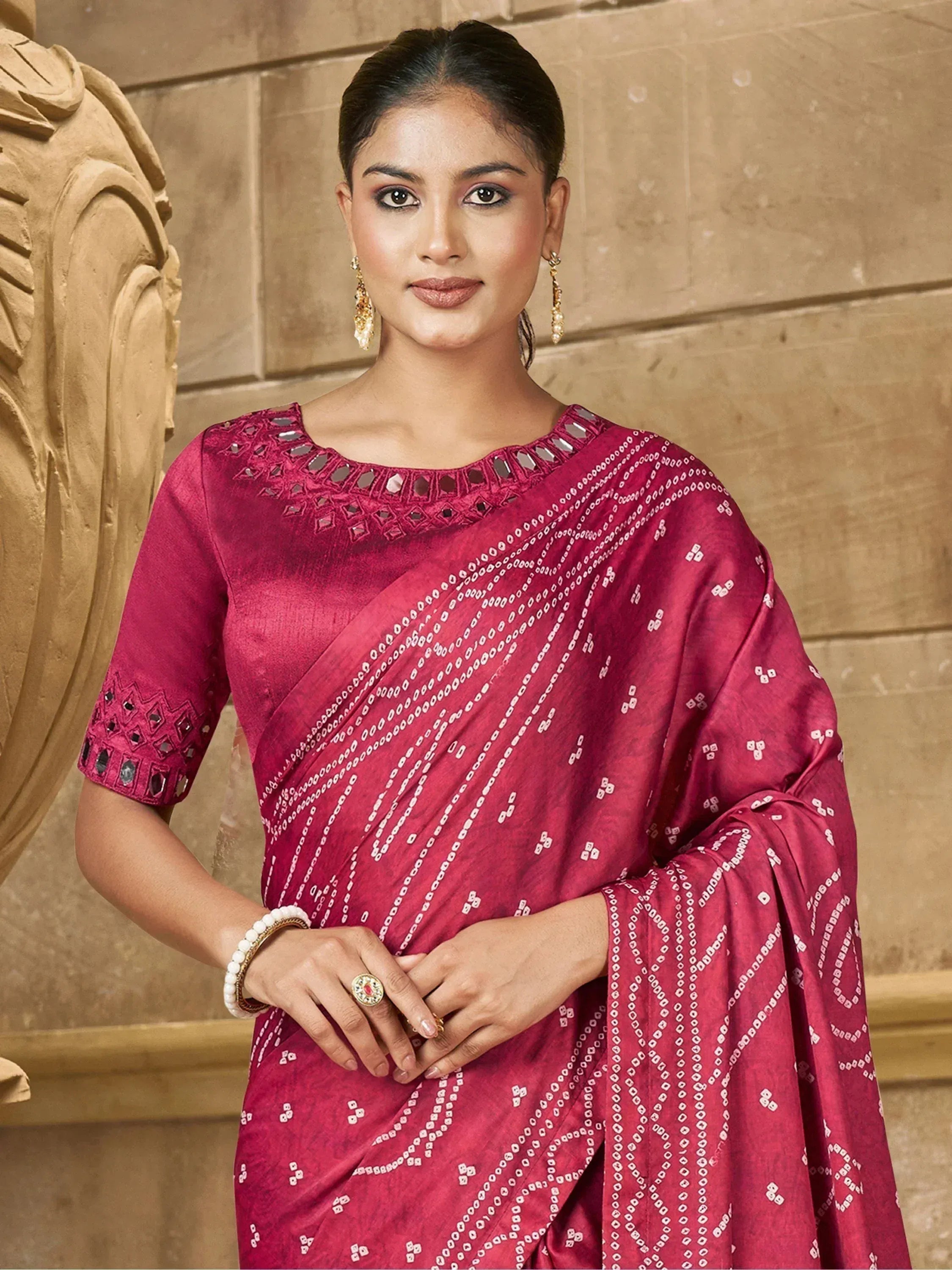 Woman in maroon ethnic saree with mirror work and geometric print, styled for Indian occasions