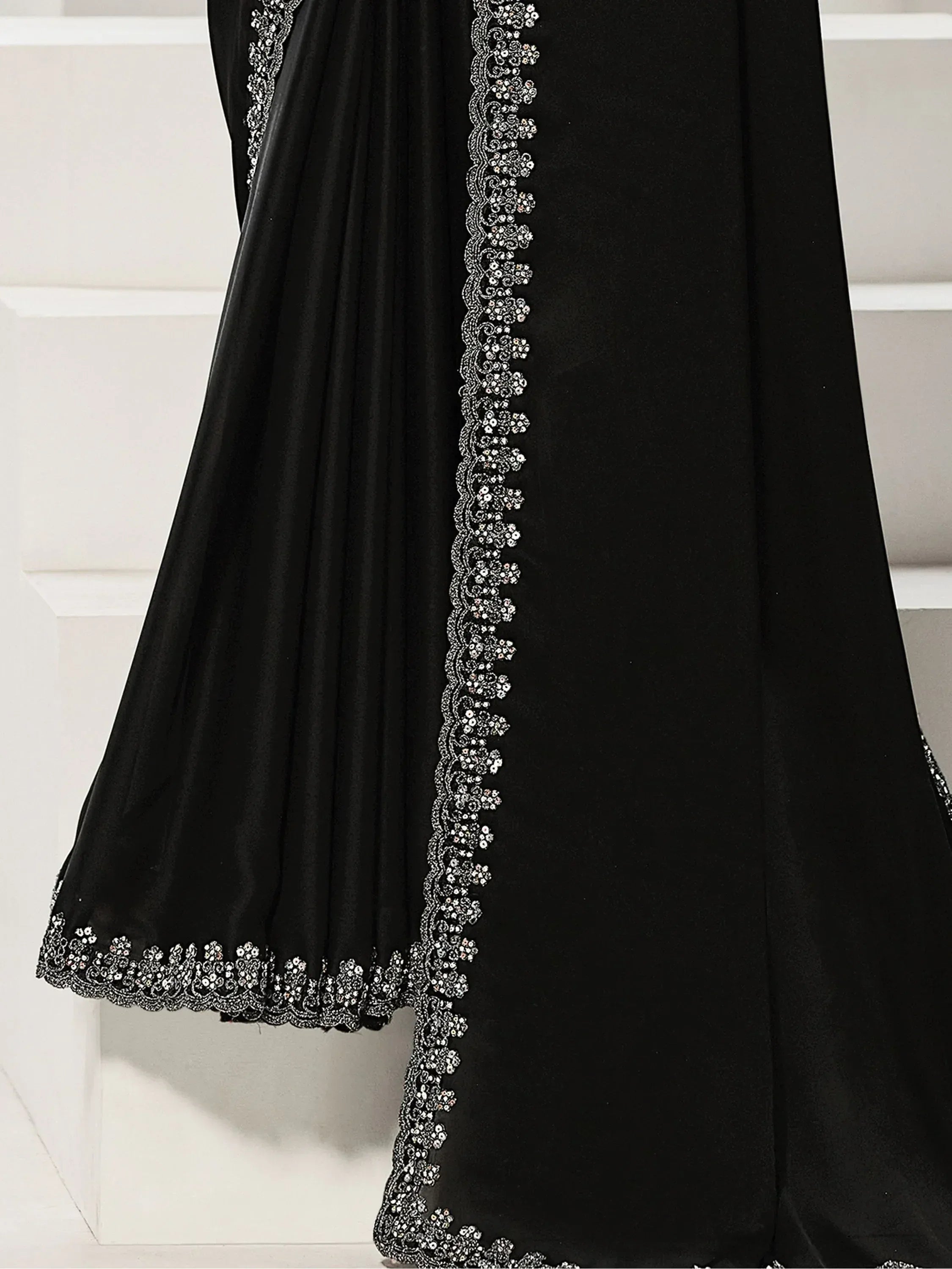 Black ethnic gown with silver floral embroidery, perfect for Indian occasions and festive wear.