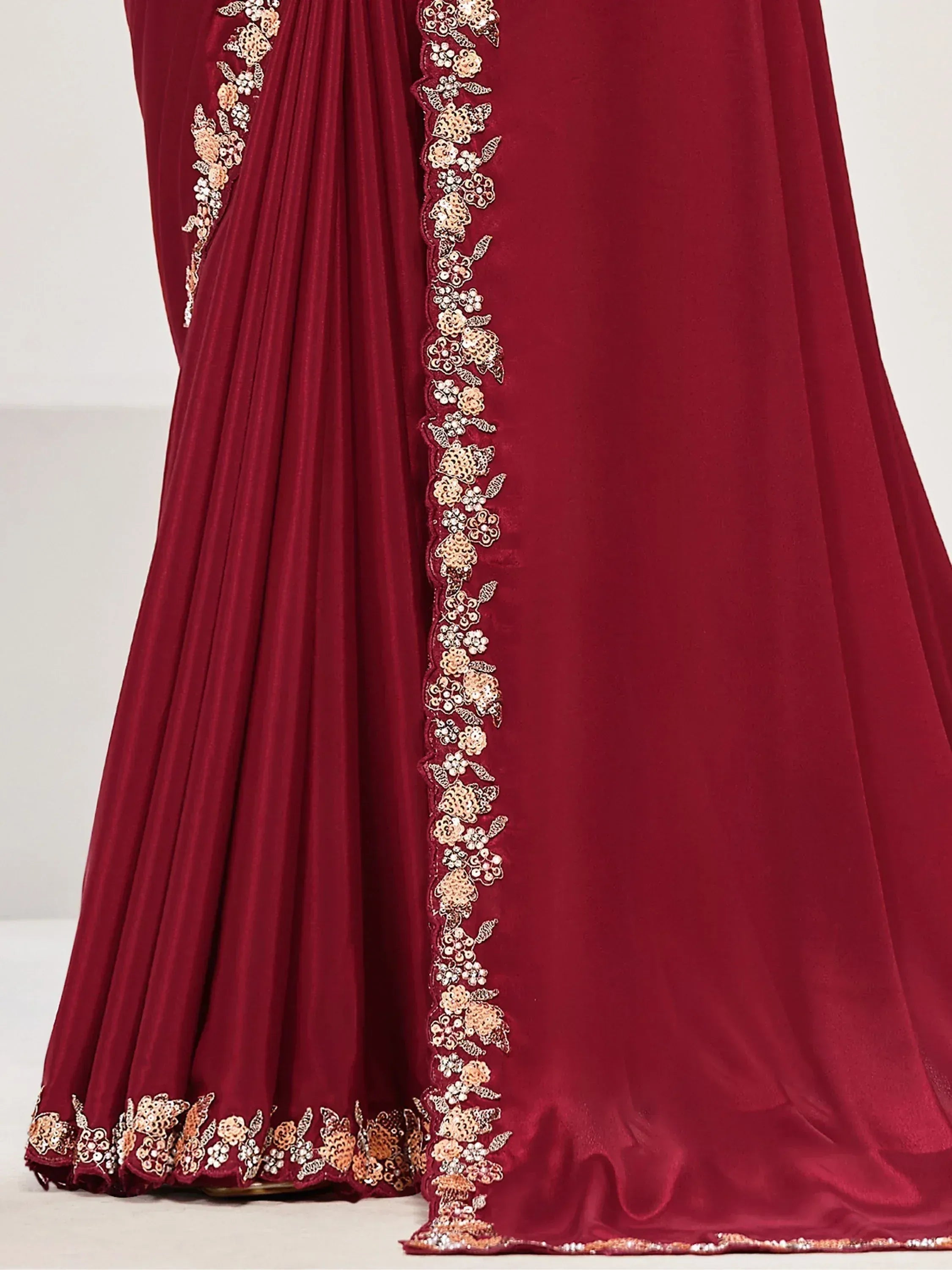 Maroon velvet ethnic gown with gold floral embroidery and pleated skirt detail