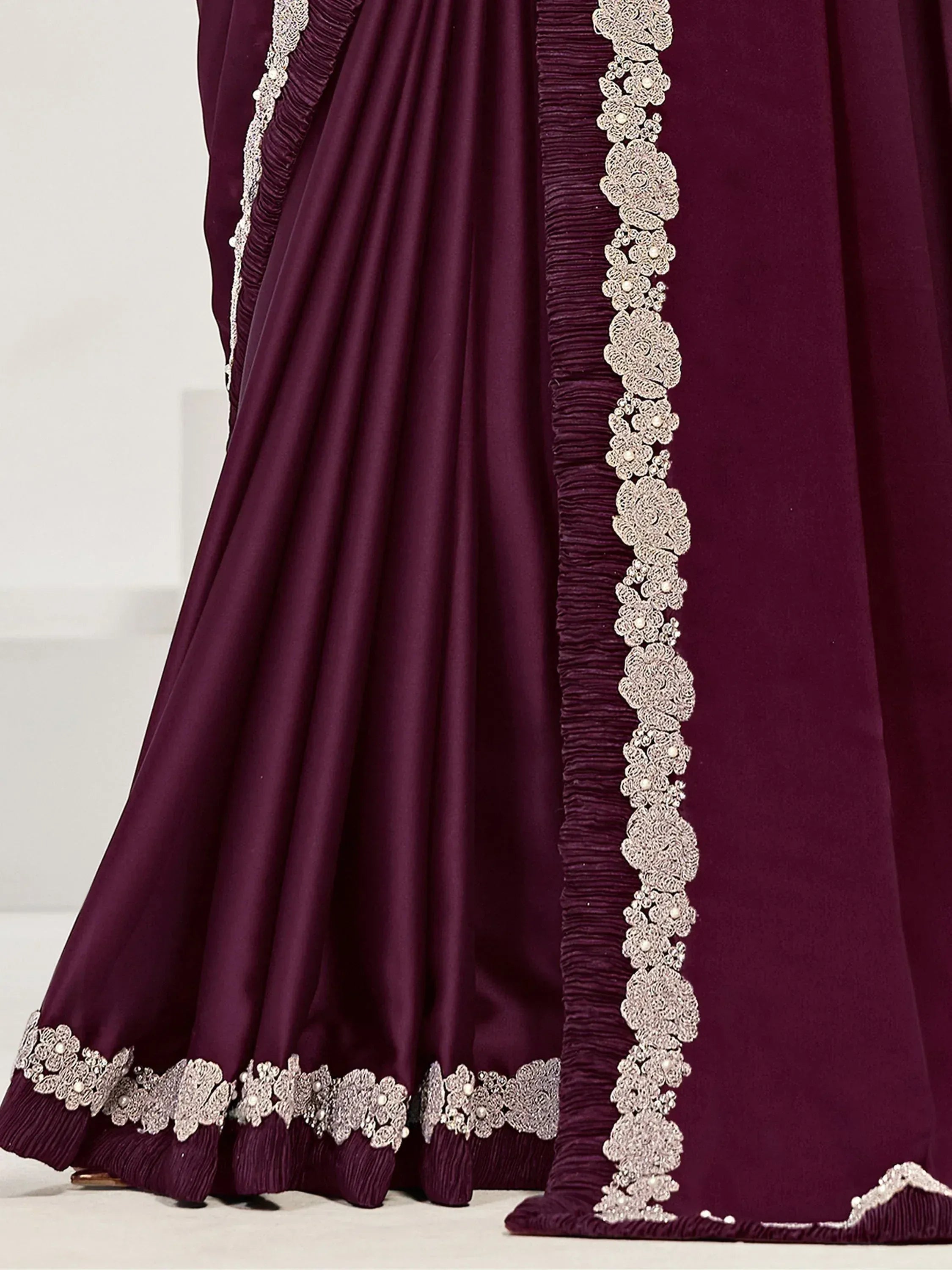 Elegant maroon lehenga with intricate silver floral embroidery and pleated detailing