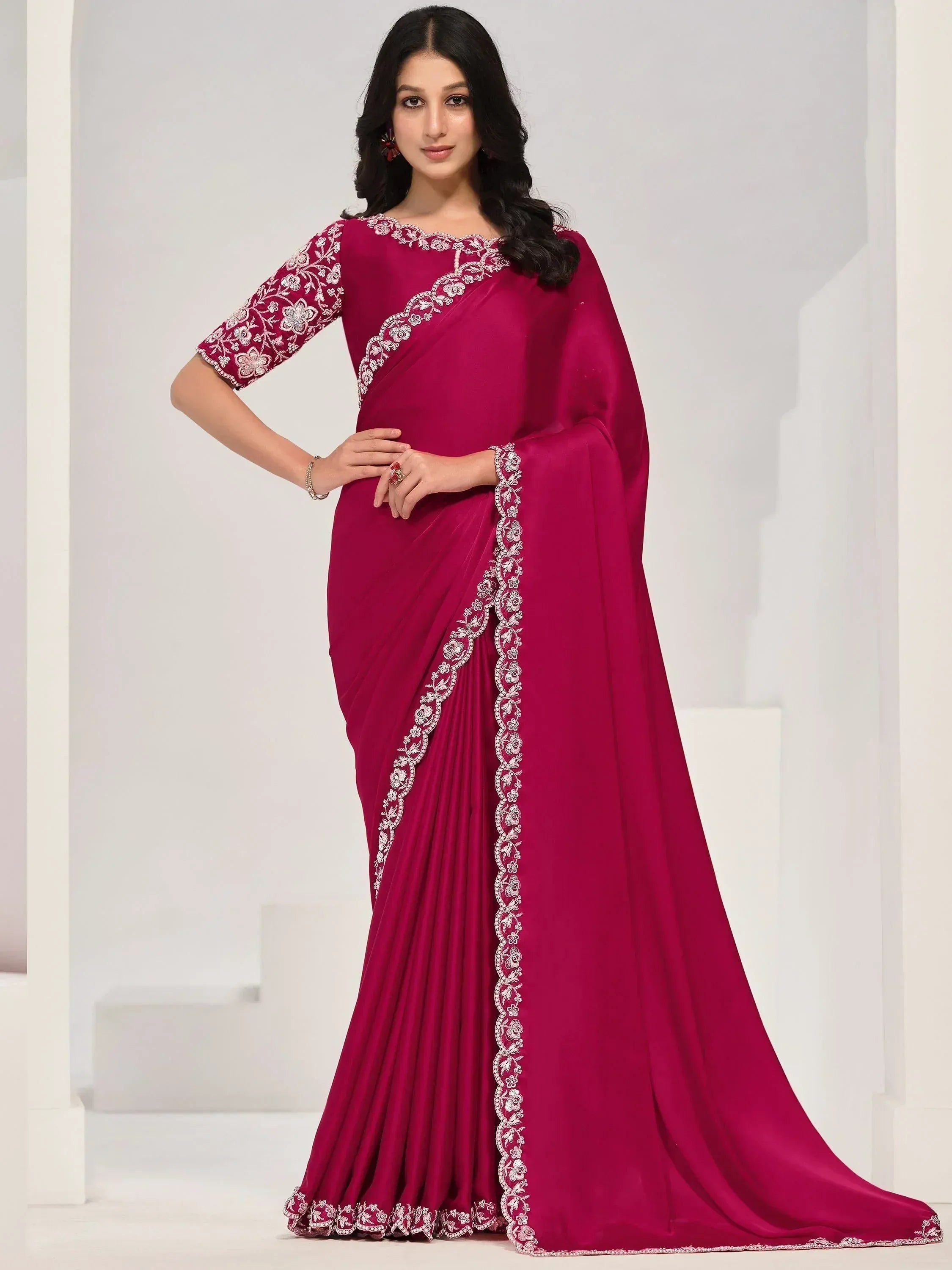 Elegant magenta saree with white floral embroidery, perfect for Indian ethnic occasions and weddings.