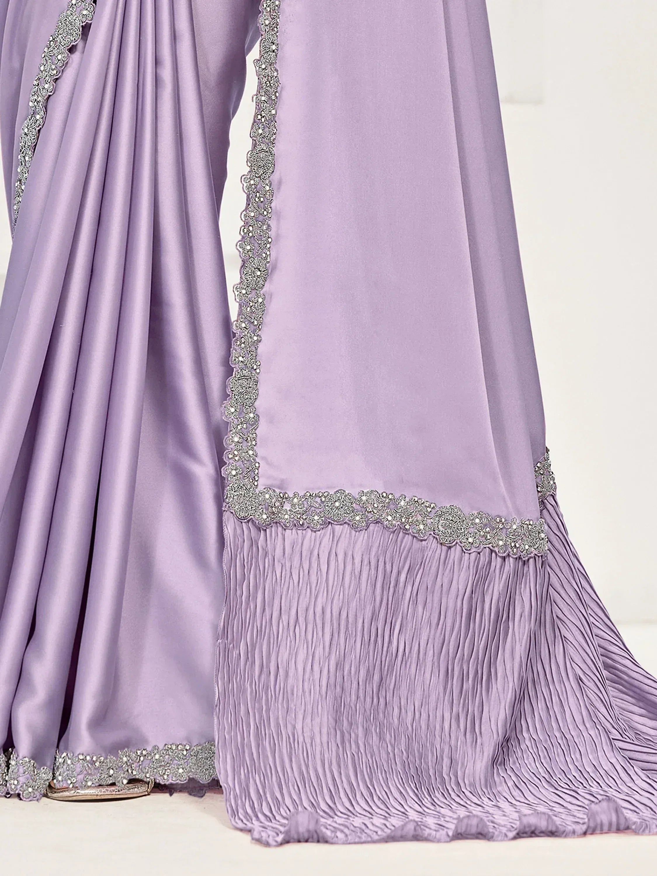 Lavender ethnic gown with silver embroidery and pleated hem, perfect for Indian celebrations