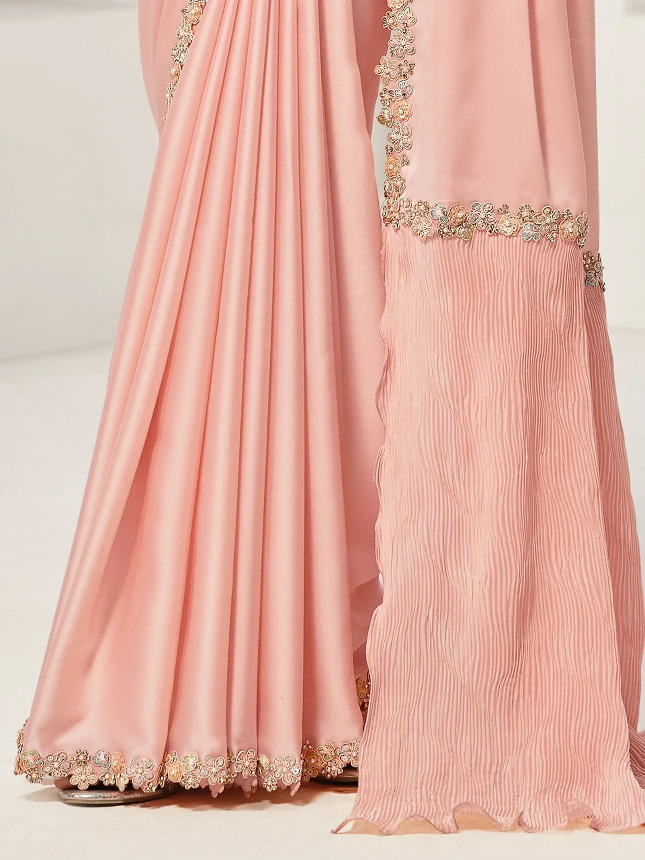 Pink ethnic gown with floral embroidery and pleated detailing, perfect for Indian festive wear