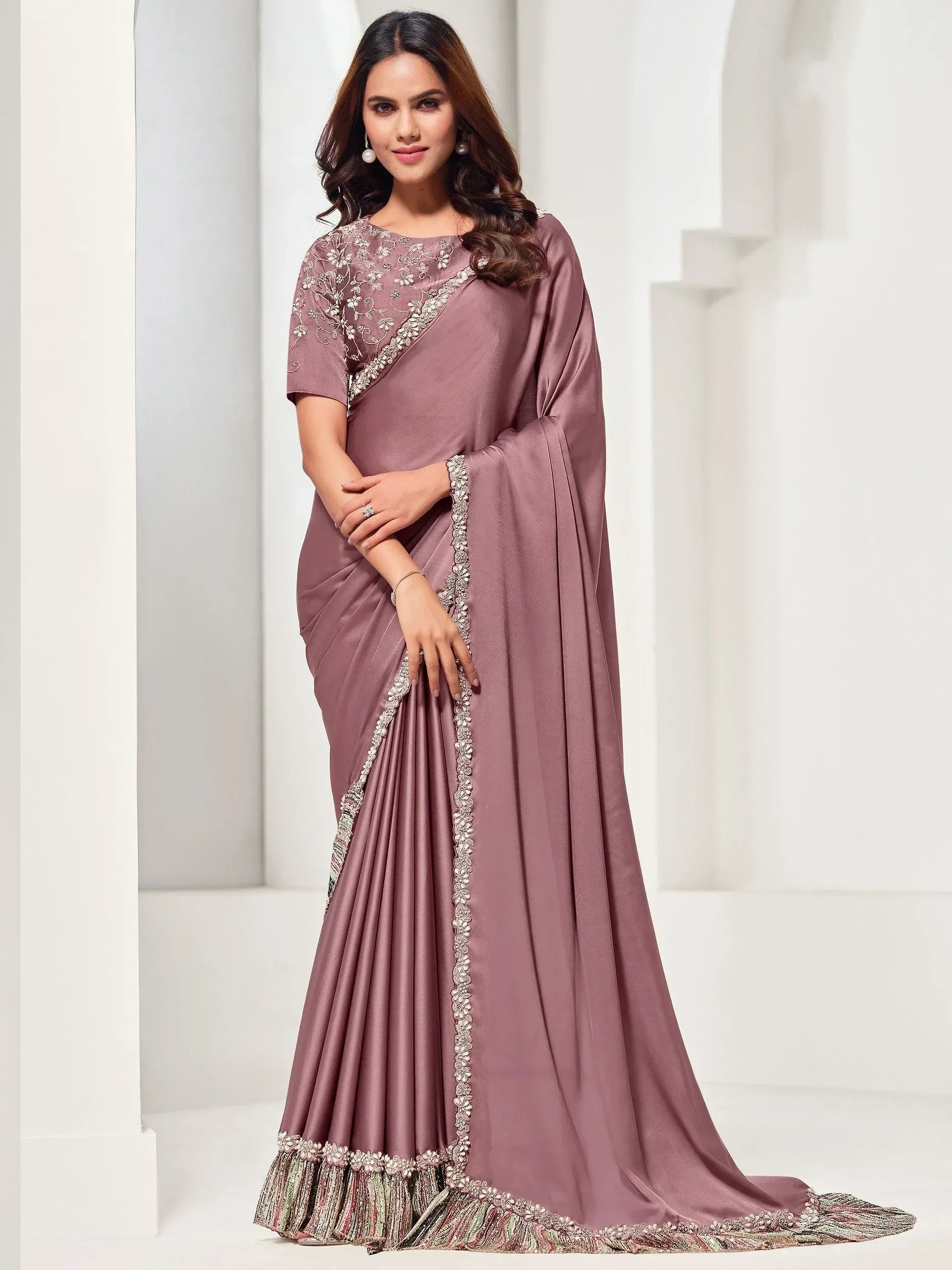 Elegant mauve saree with floral embroidery and embellished border, perfect for Indian ethnic occasions