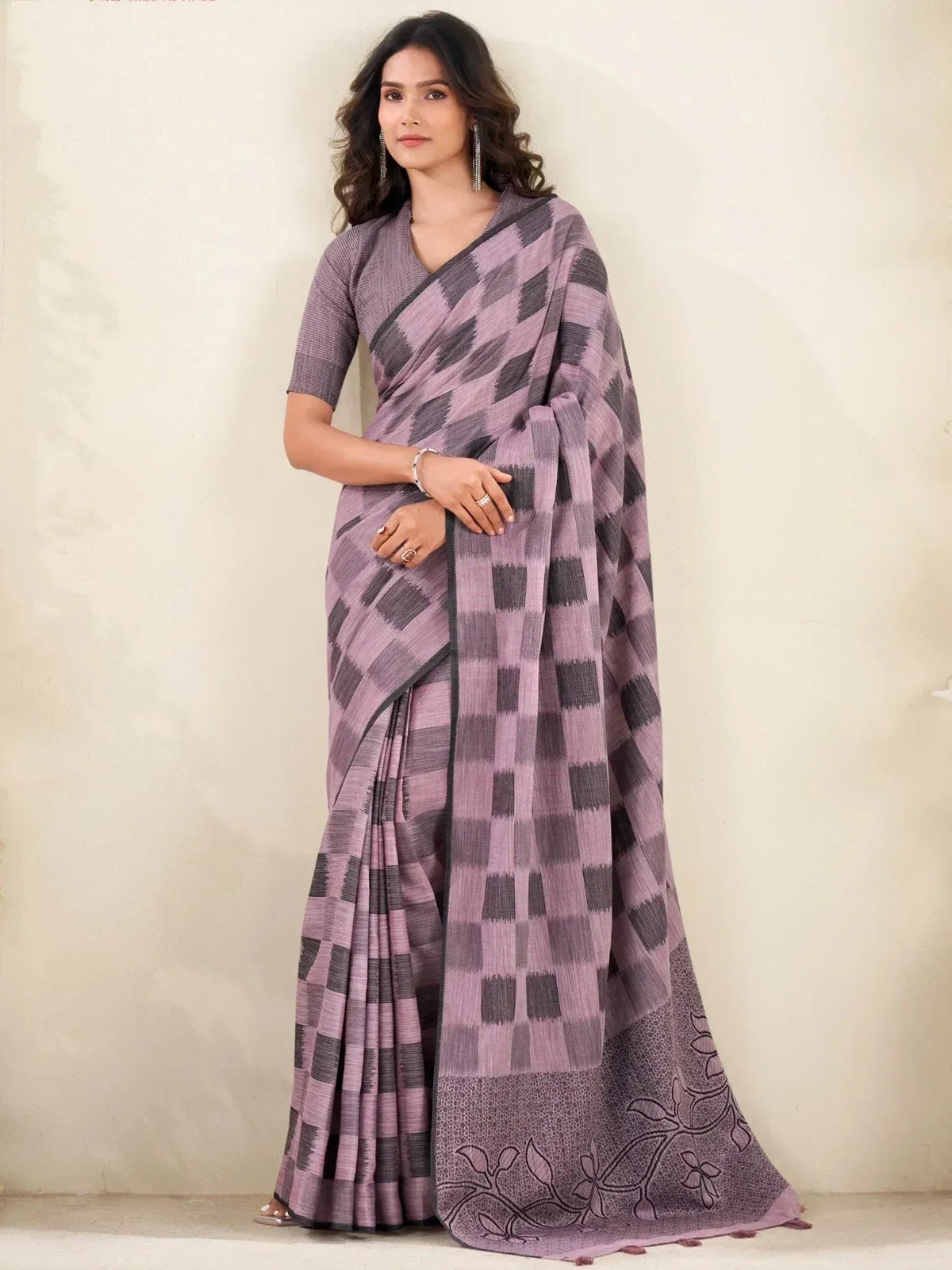 Purple and gray checkered saree with floral border, styled with matching blouse for ethnic wear