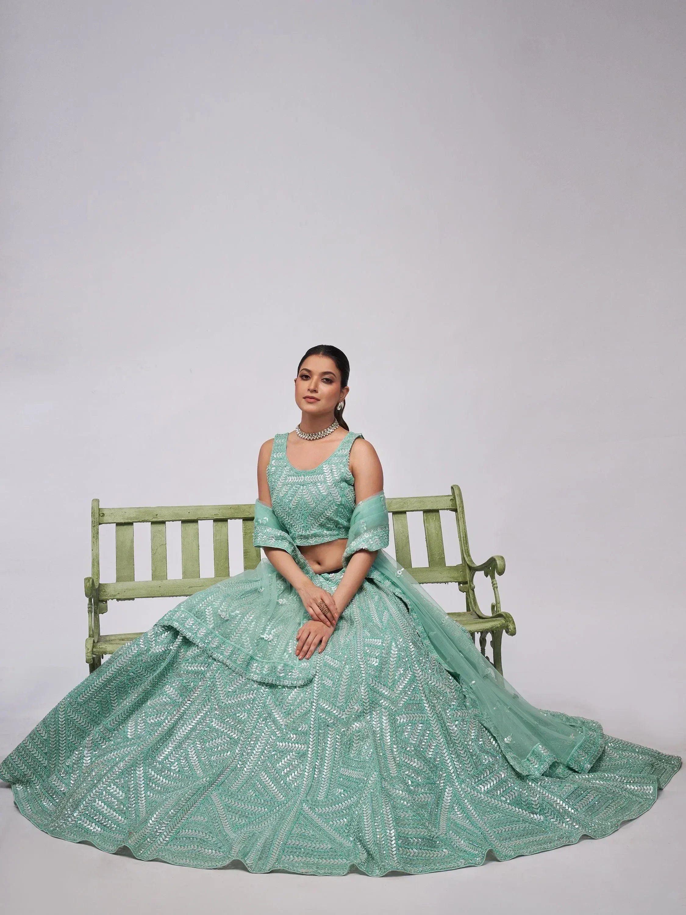 Enchanting Sky Blue Heavy Sequins Net Reception Wear Lehenga Choli