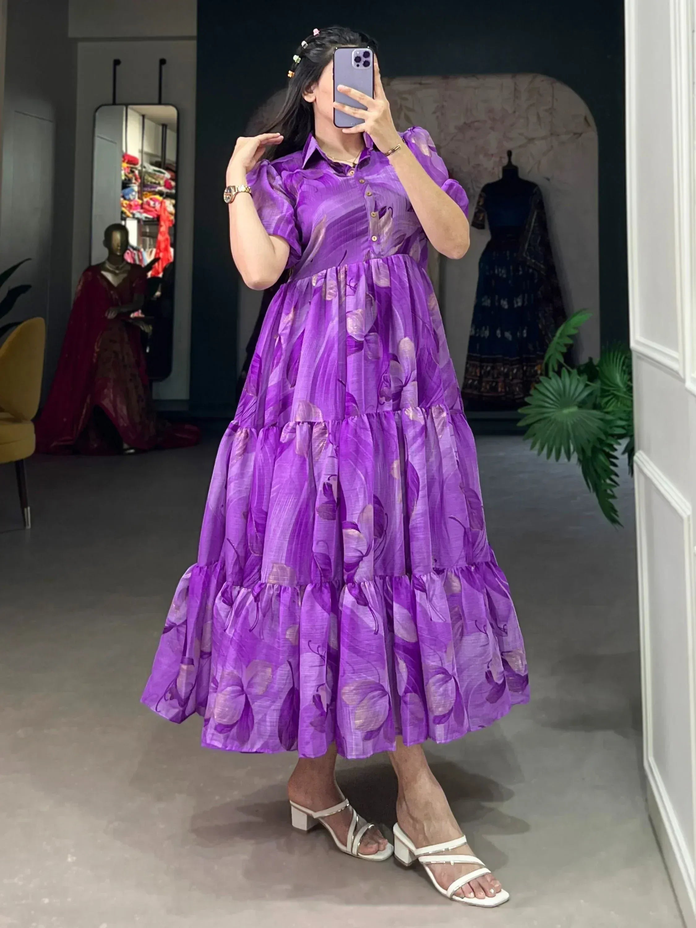 Purple floral tiered ethnic gown with puff sleeves, perfect for Indian occasions and festive wear.