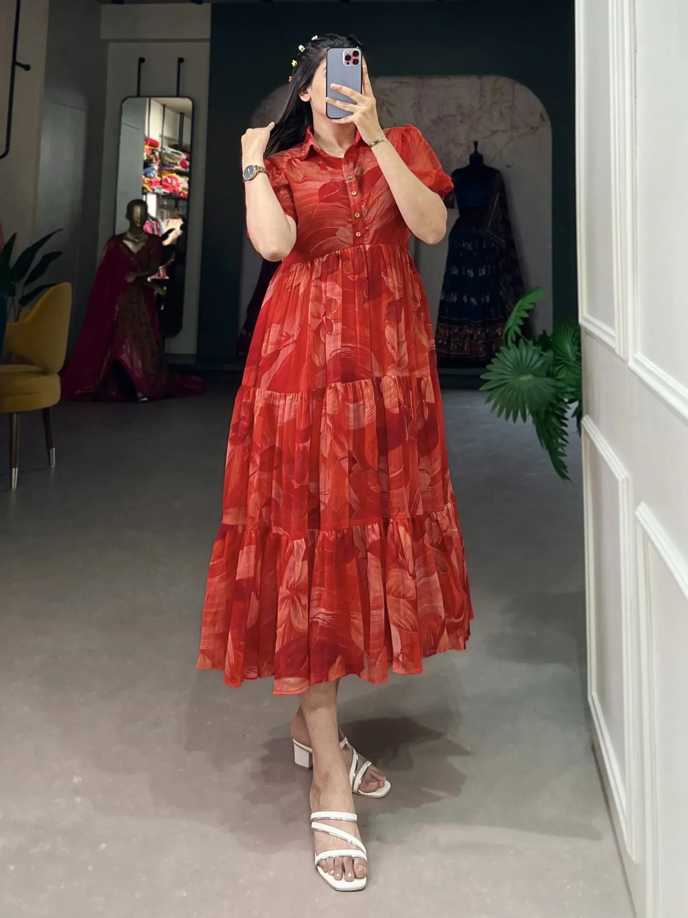 Red floral tiered ethnic gown with puff sleeves, perfect for Indian occasions and festive wear.