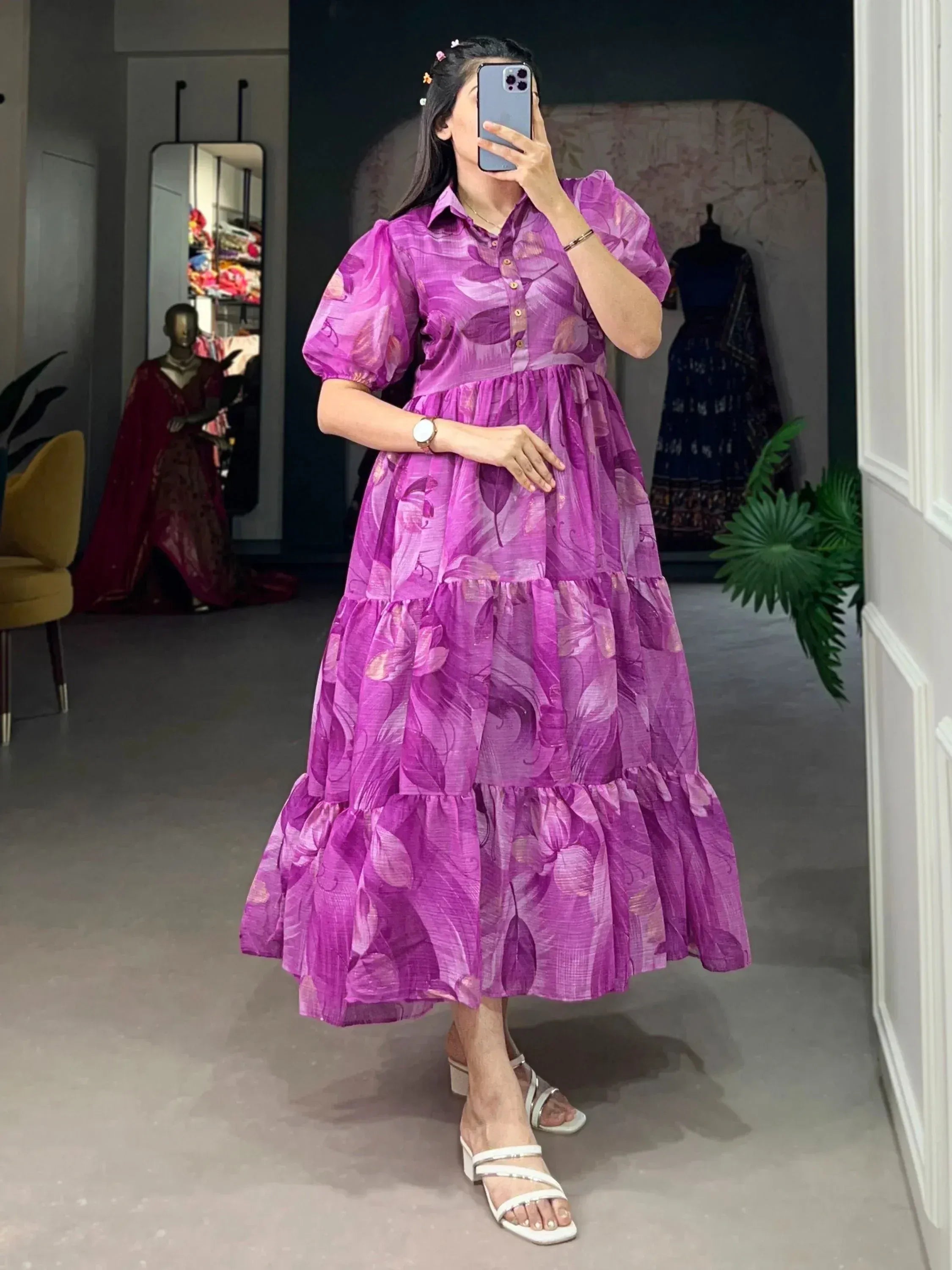 Purple floral tiered ethnic gown with puff sleeves, perfect for festive occasions and Indian wear.
