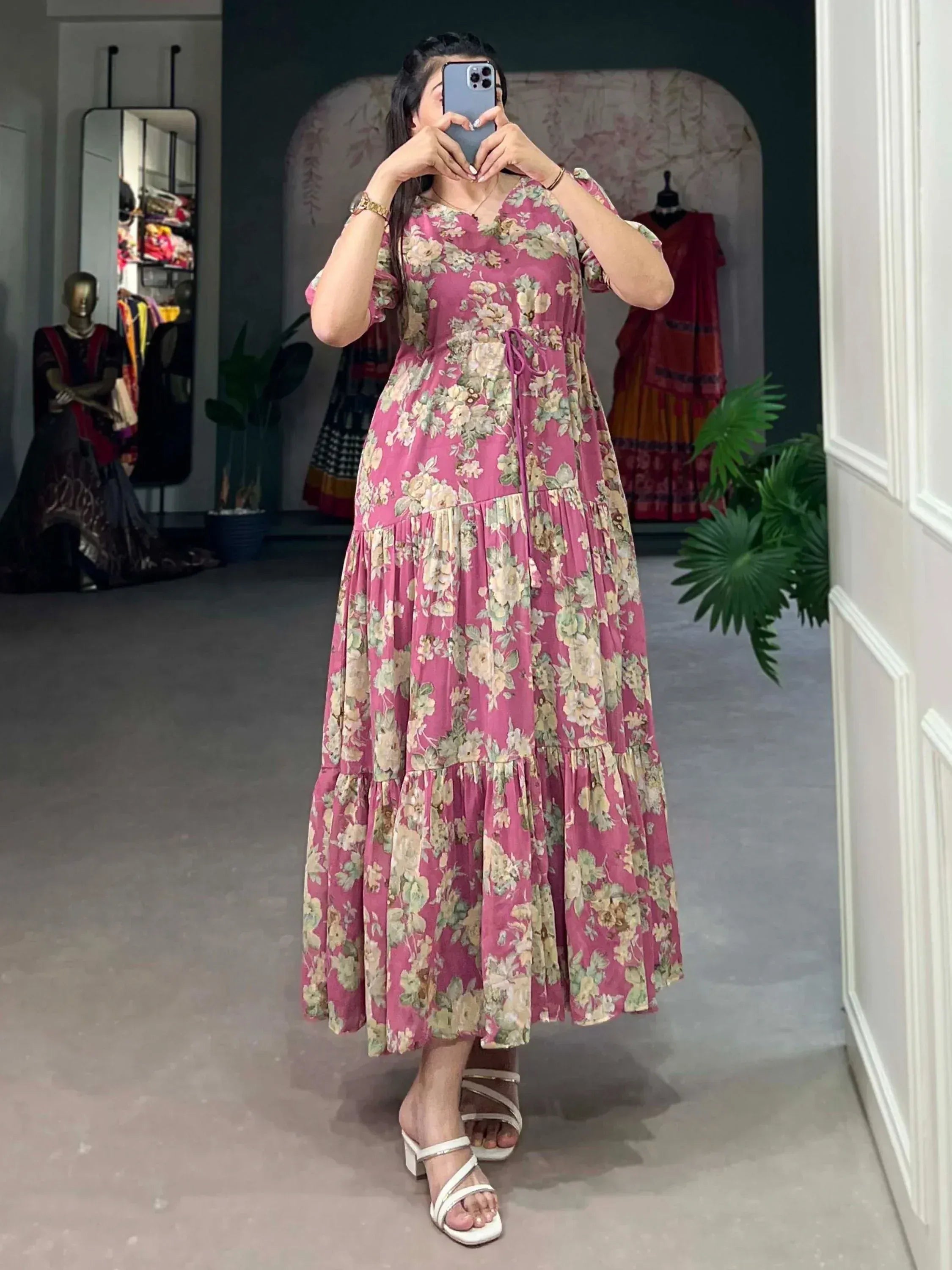 Pink floral ethnic gown with tiered design, perfect for Indian occasions