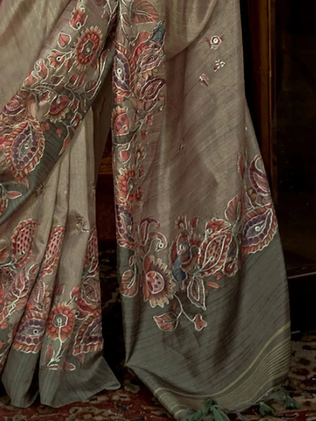 Grey saree with intricate red and purple floral embroidery, perfect for ethnic occasions.
