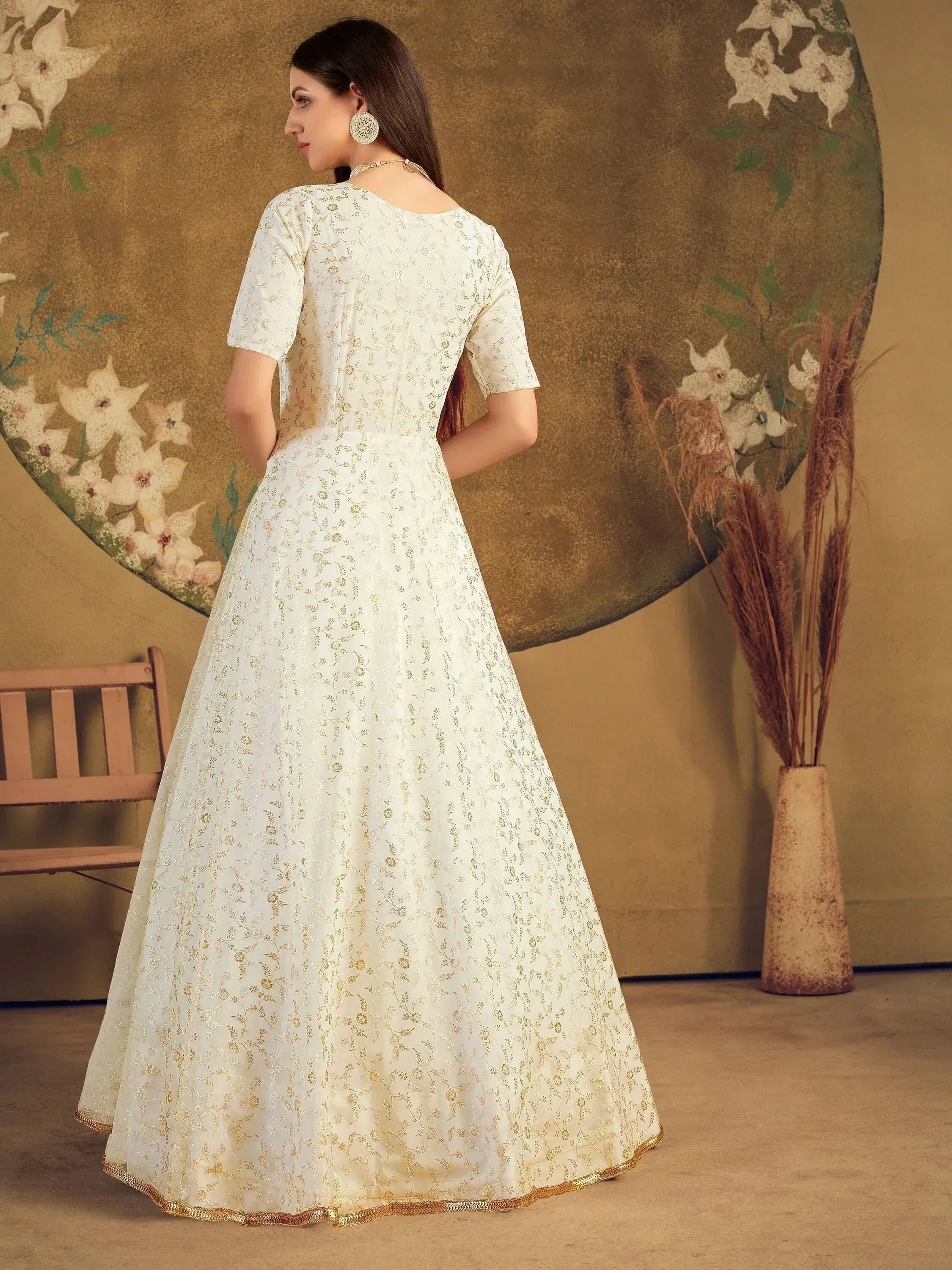 White ethnic gown with gold floral embroidery, back view, perfect for Indian occasions