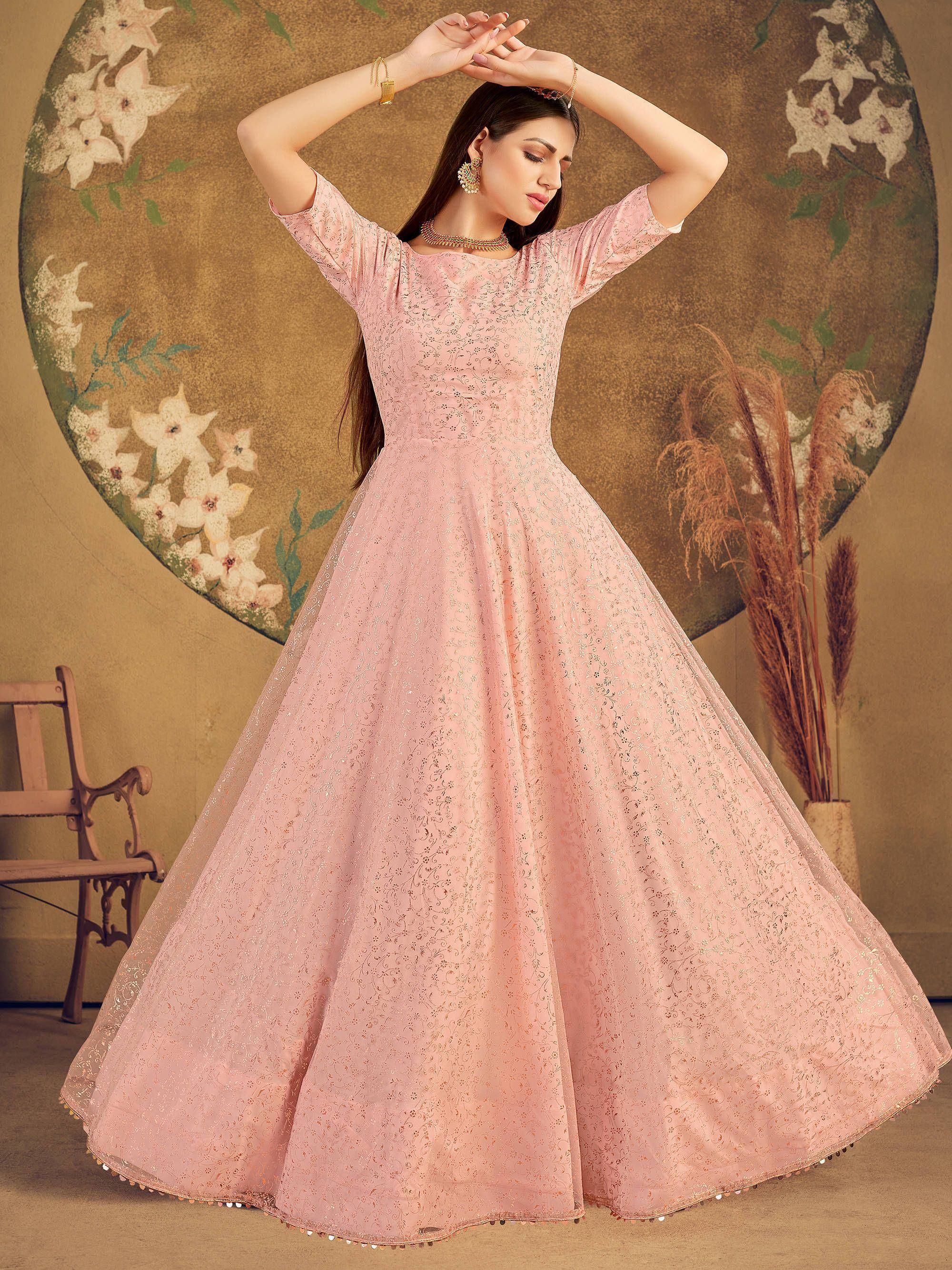 Pink embroidered ethnic gown with flared skirt, perfect for Indian weddings and festive occasions