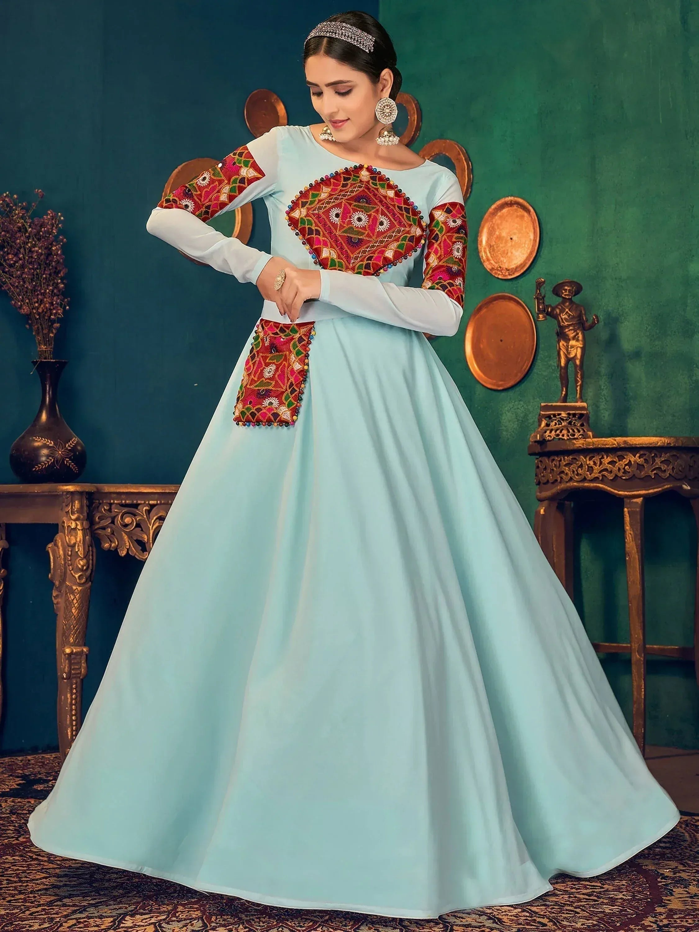 Light blue ethnic gown with colorful mirror work and embroidery, perfect for Indian celebrations