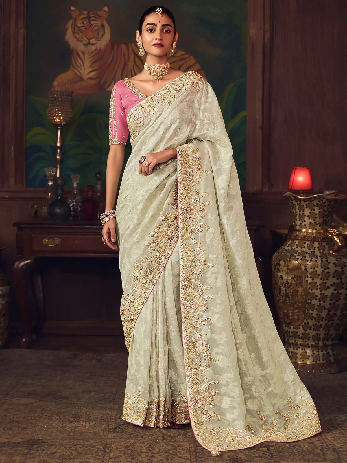 Elegant light green saree with gold embroidery and pink blouse, perfect for Indian ethnic wear