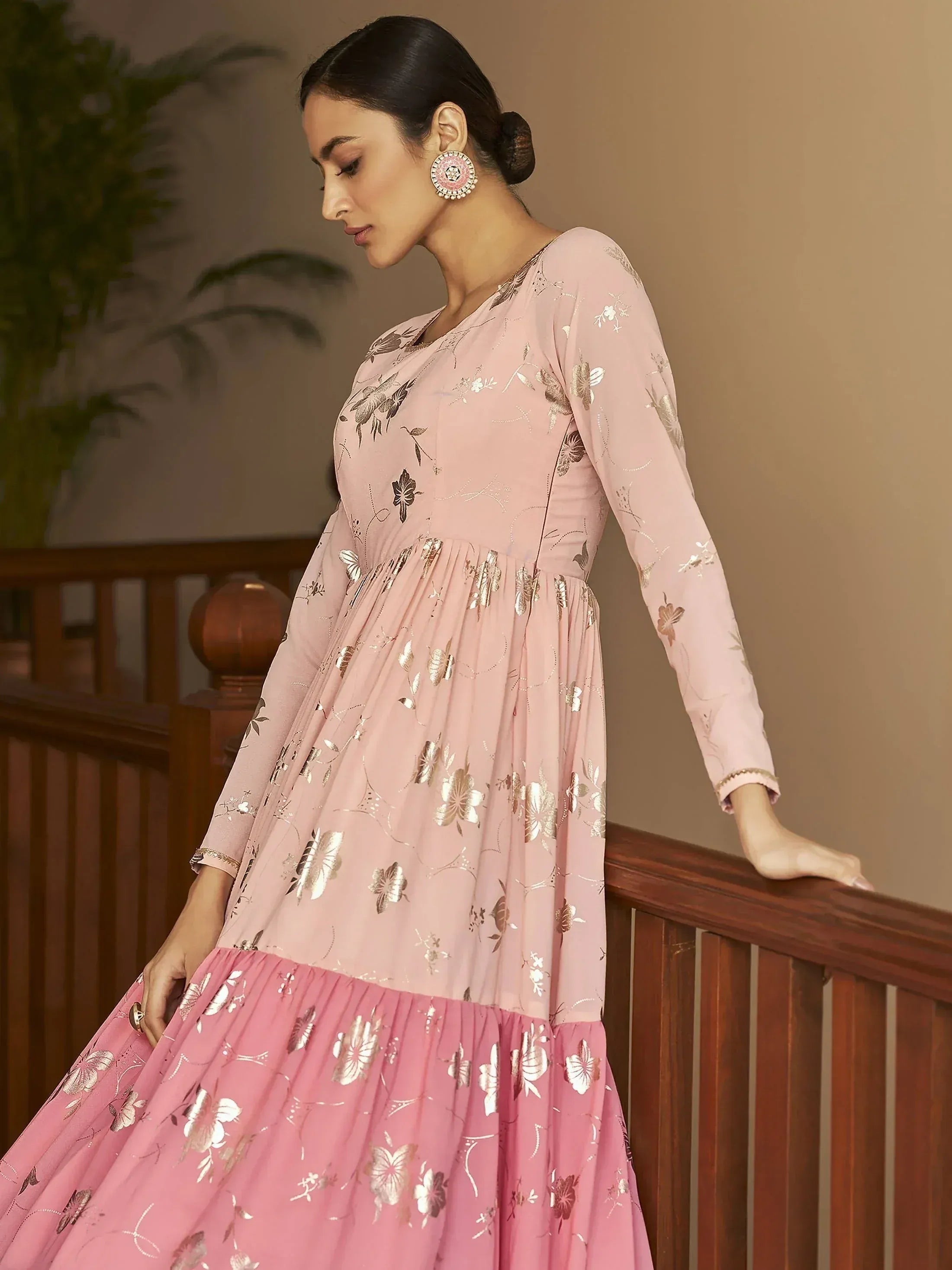 Pink floral print ethnic gown with gold embroidery, long sleeves, and pleated skirt for women