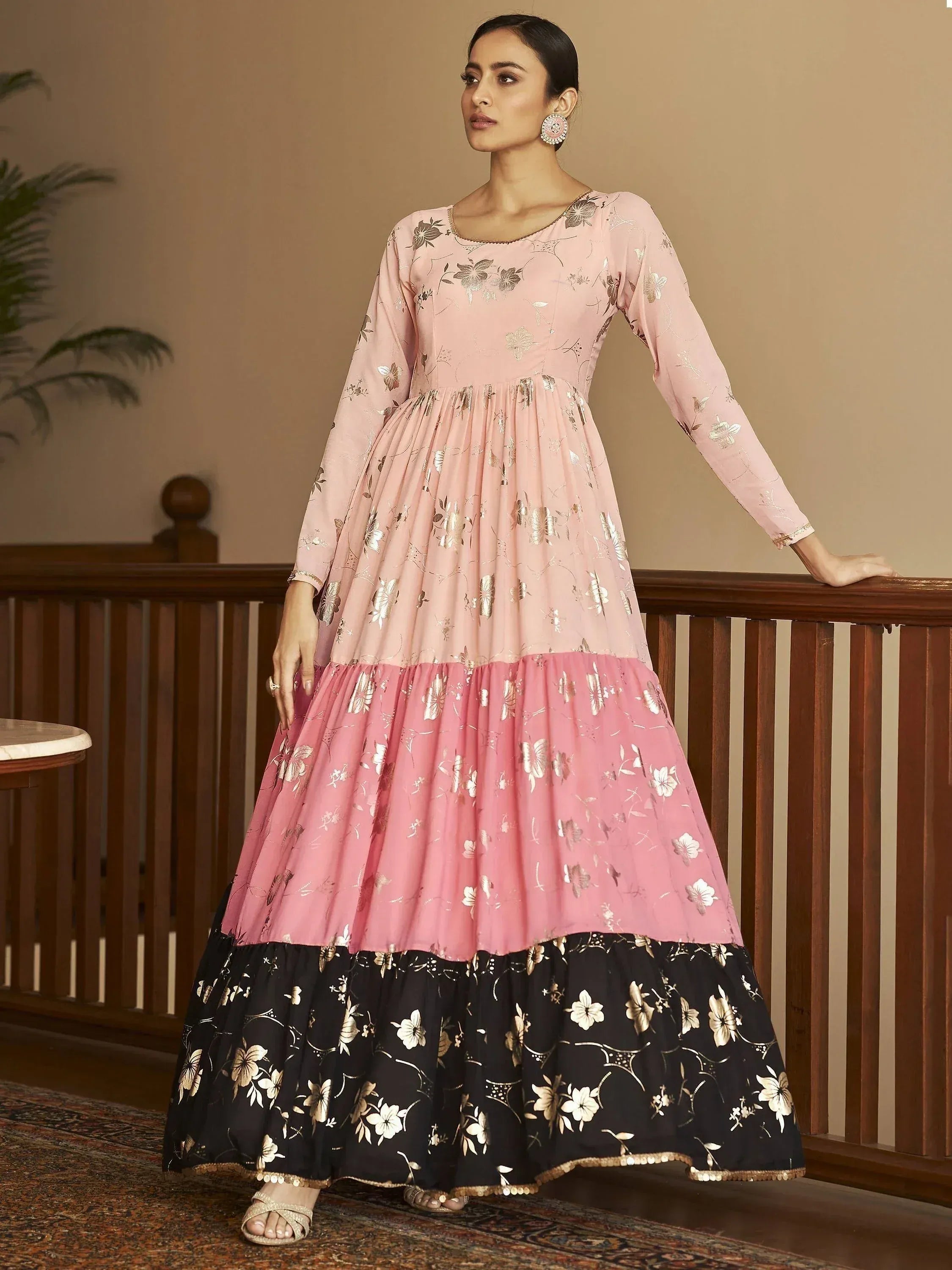 Pink and black floral print ethnic gown with gold detailing, perfect for Indian occasions