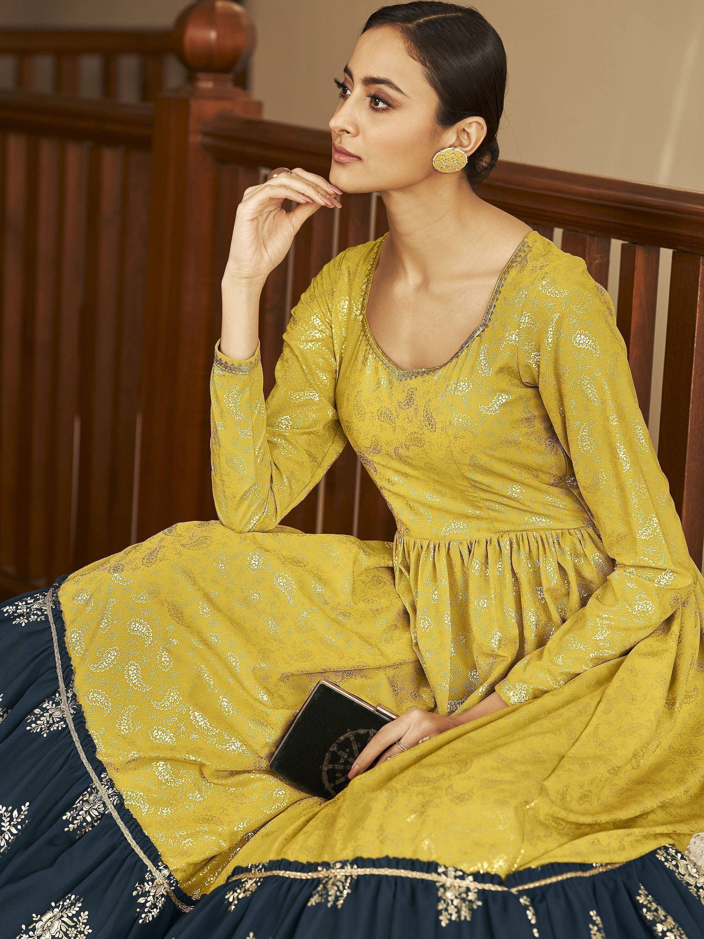 Yellow and navy blue ethnic gown with floral embroidery, perfect for Indian festive occasions.