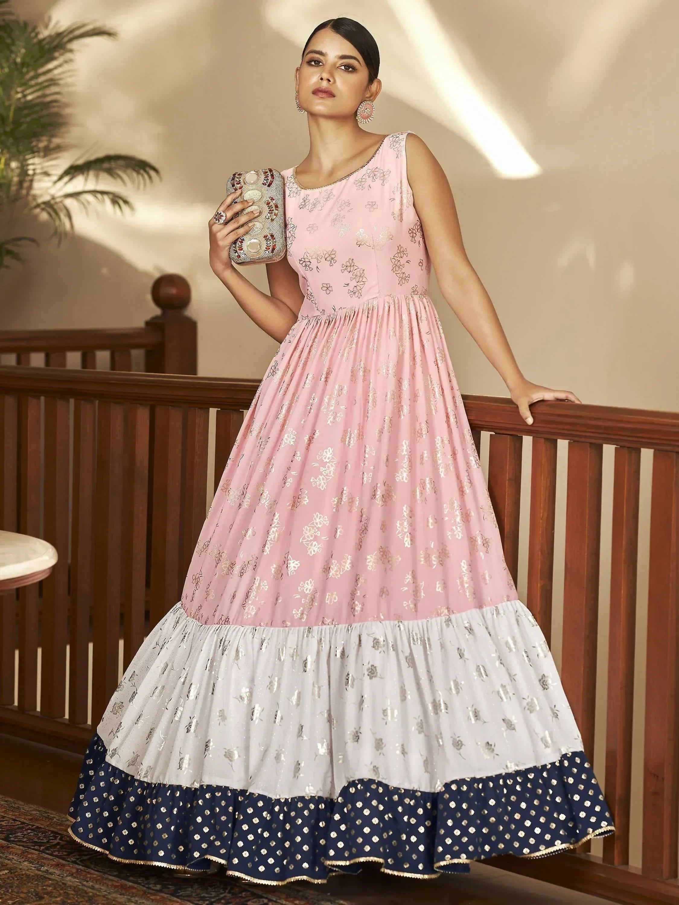 Pink and navy floral ethnic gown with gold embroidery, perfect for Indian festive occasions.