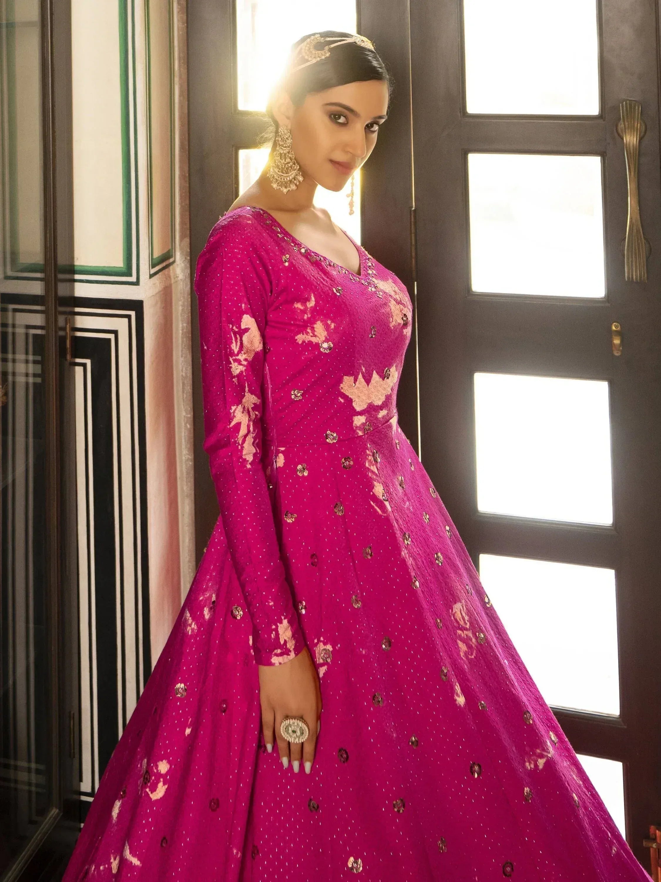 Fuchsia Indian ethnic gown with gold embroidery, perfect for weddings or festive occasions