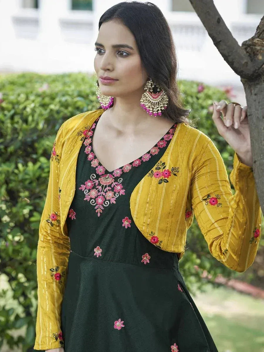 Green floral embroidered ethnic gown with mustard yellow jacket, perfect for Indian occasions