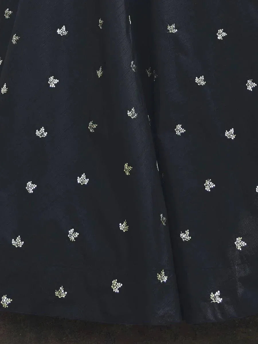 Black ethnic lehenga skirt with gold and white floral embroidery patterns