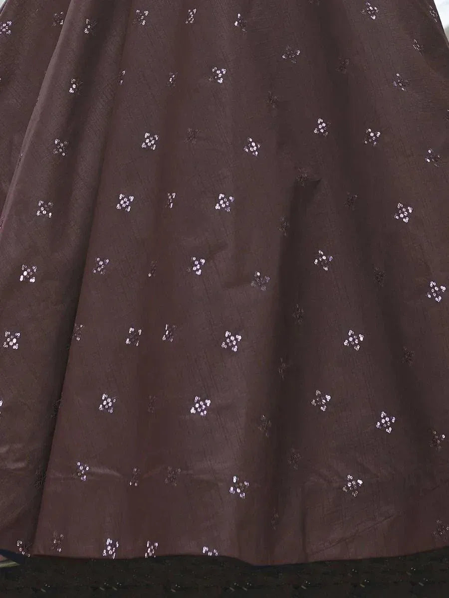 Brown ethnic gown with delicate white floral embroidery, perfect for Indian festive wear.