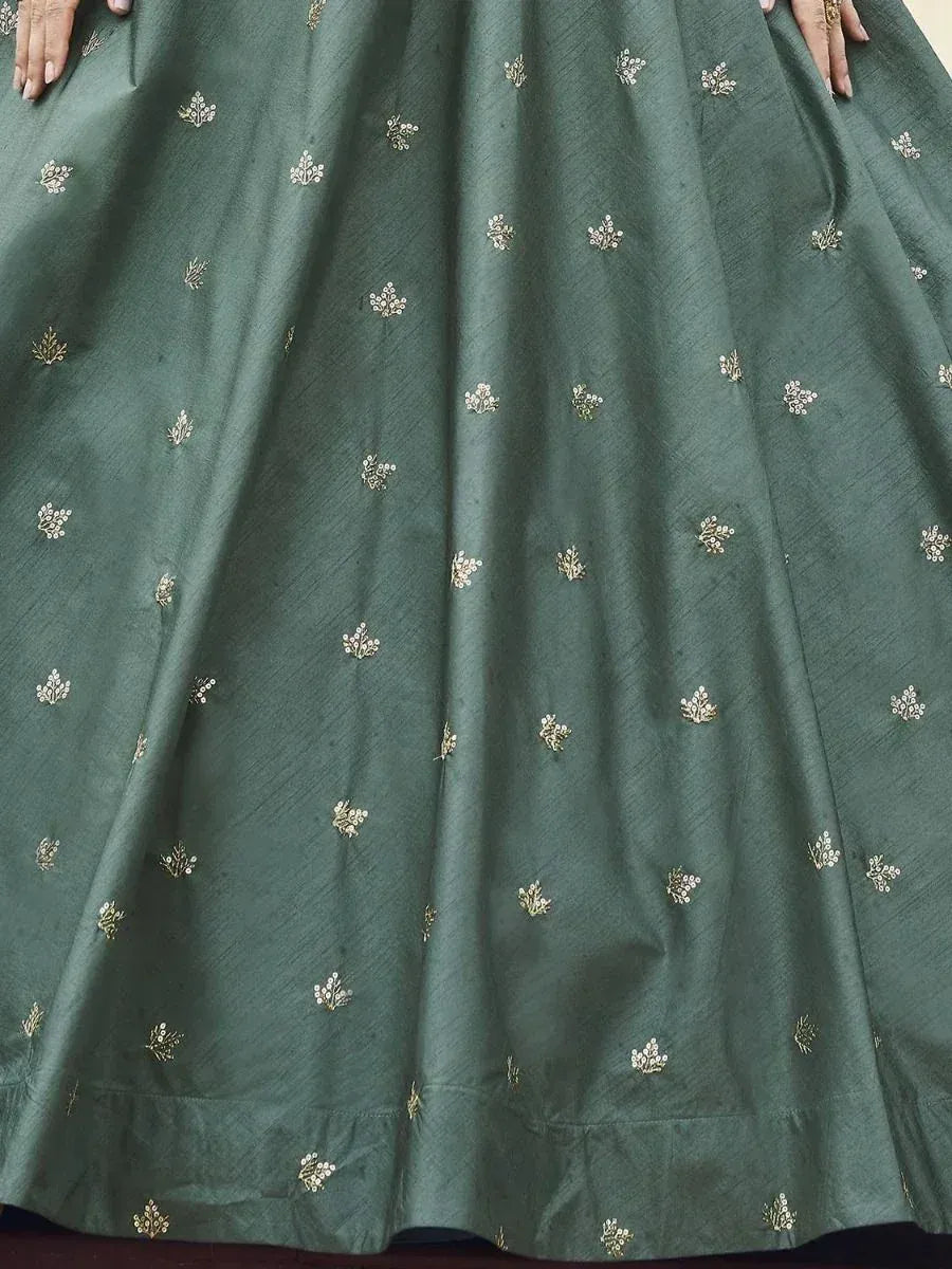 Emerald green lehenga skirt with delicate gold floral embroidery, perfect for Indian ethnic wear occasions
