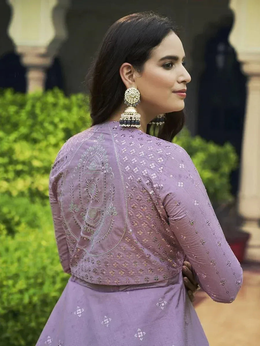 Purple embroidered ethnic kurti with detailed back design and jhumka earrings