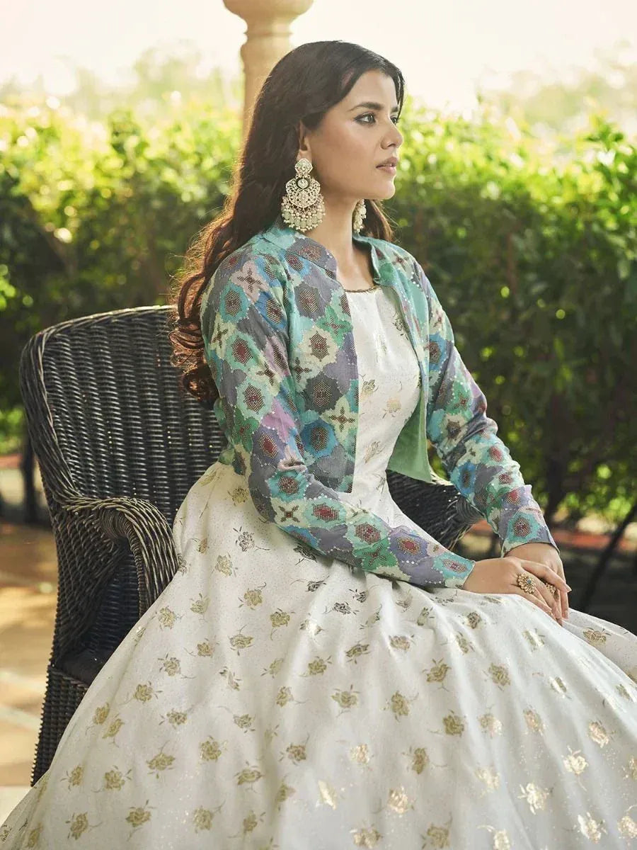 Woman in elegant white floral lehenga with colorful patterned jacket, perfect for Indian ethnic occasions