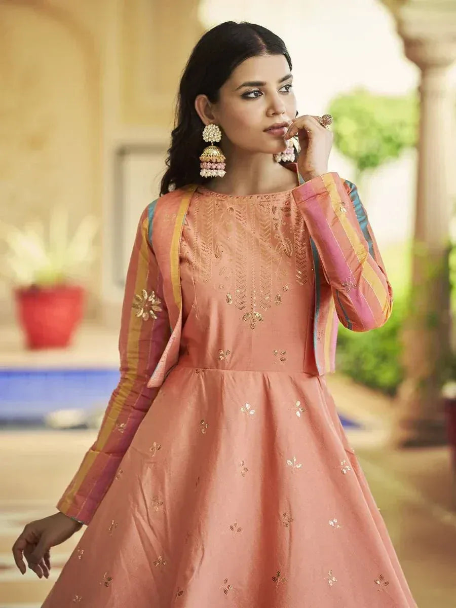 Peach embroidered ethnic gown with colorful striped sleeves, perfect for Indian festive occasions