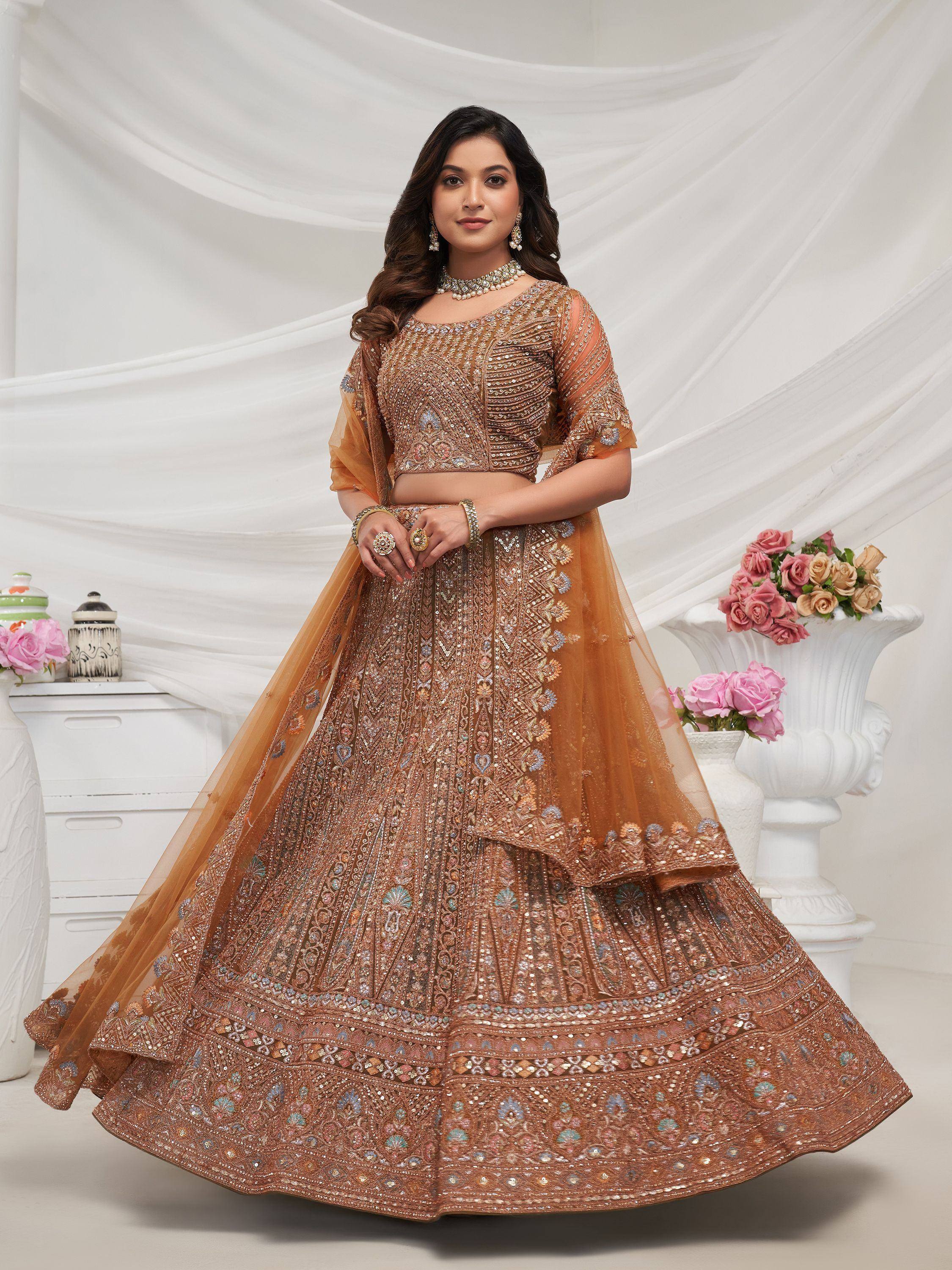 Elegant brown embroidered lehenga choli with intricate designs and floral accents for festive occasions