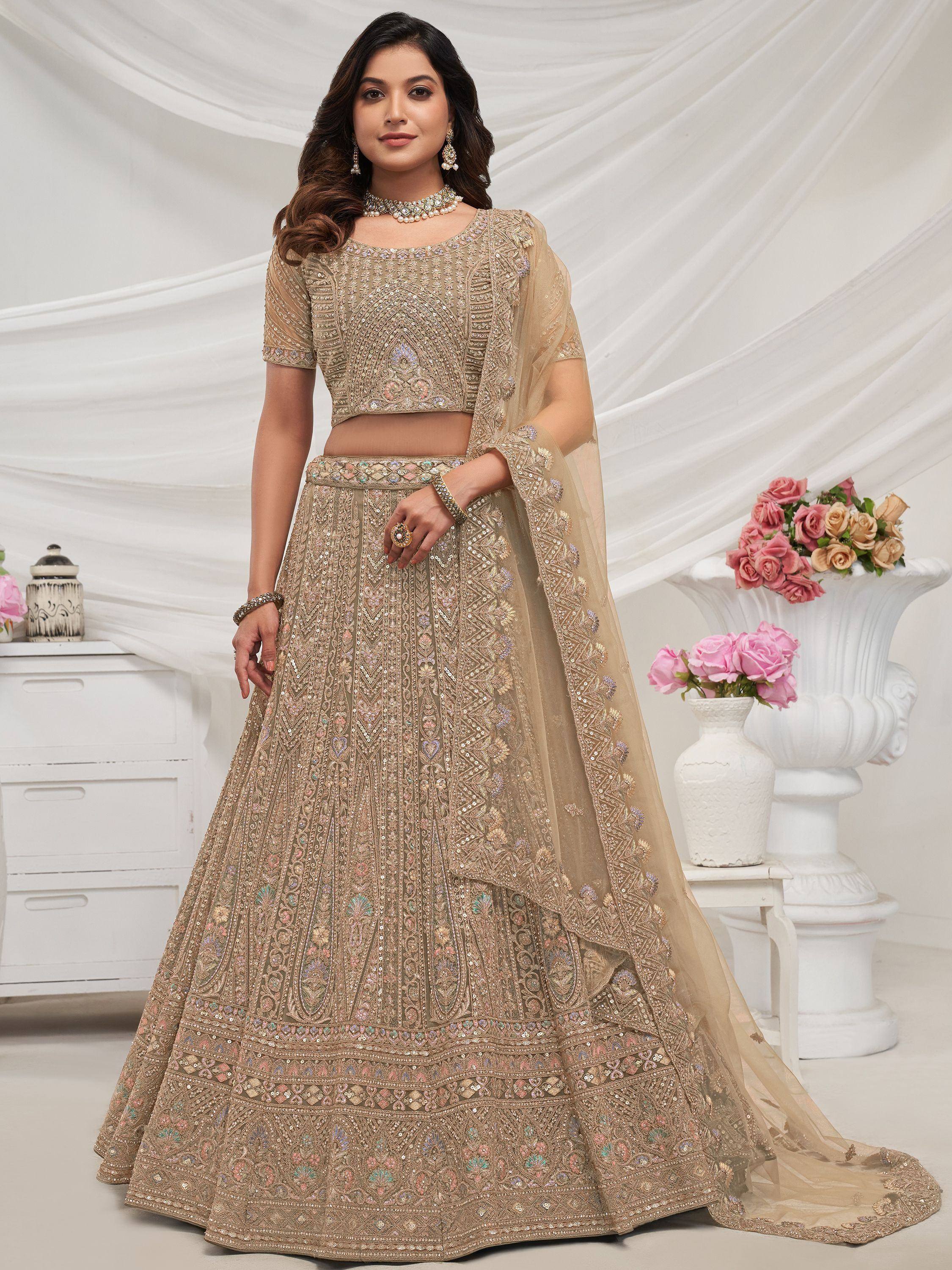 Elegant gold embroidered lehenga choli with dupatta, perfect for Indian weddings and festive occasions.