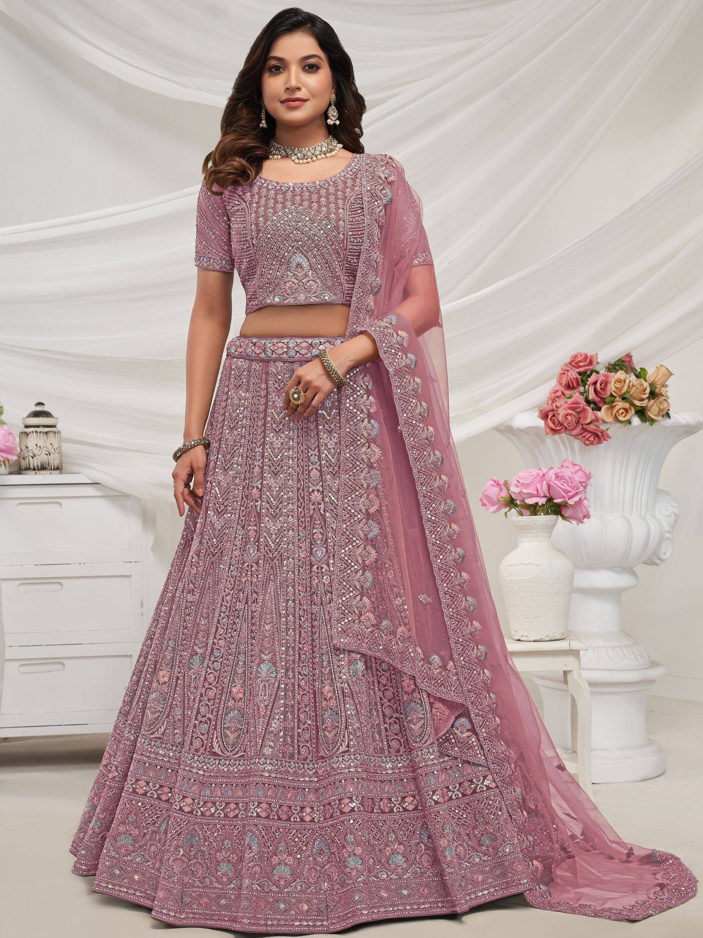 Elegant mauve lehenga choli with intricate embroidery and sequin work, perfect for Indian weddings and festive occasions.